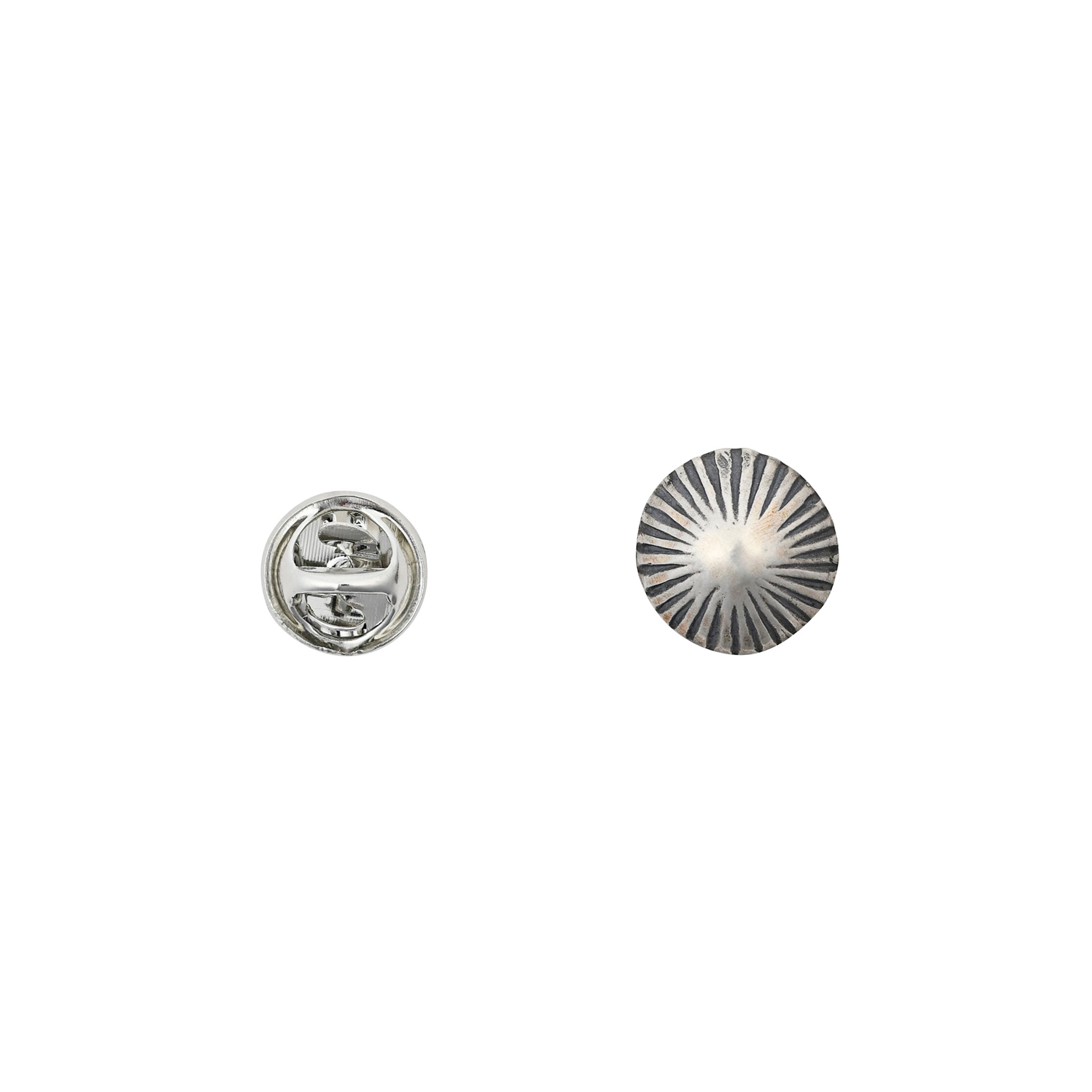 Sterling silver hat pin in the shape of a small concho.