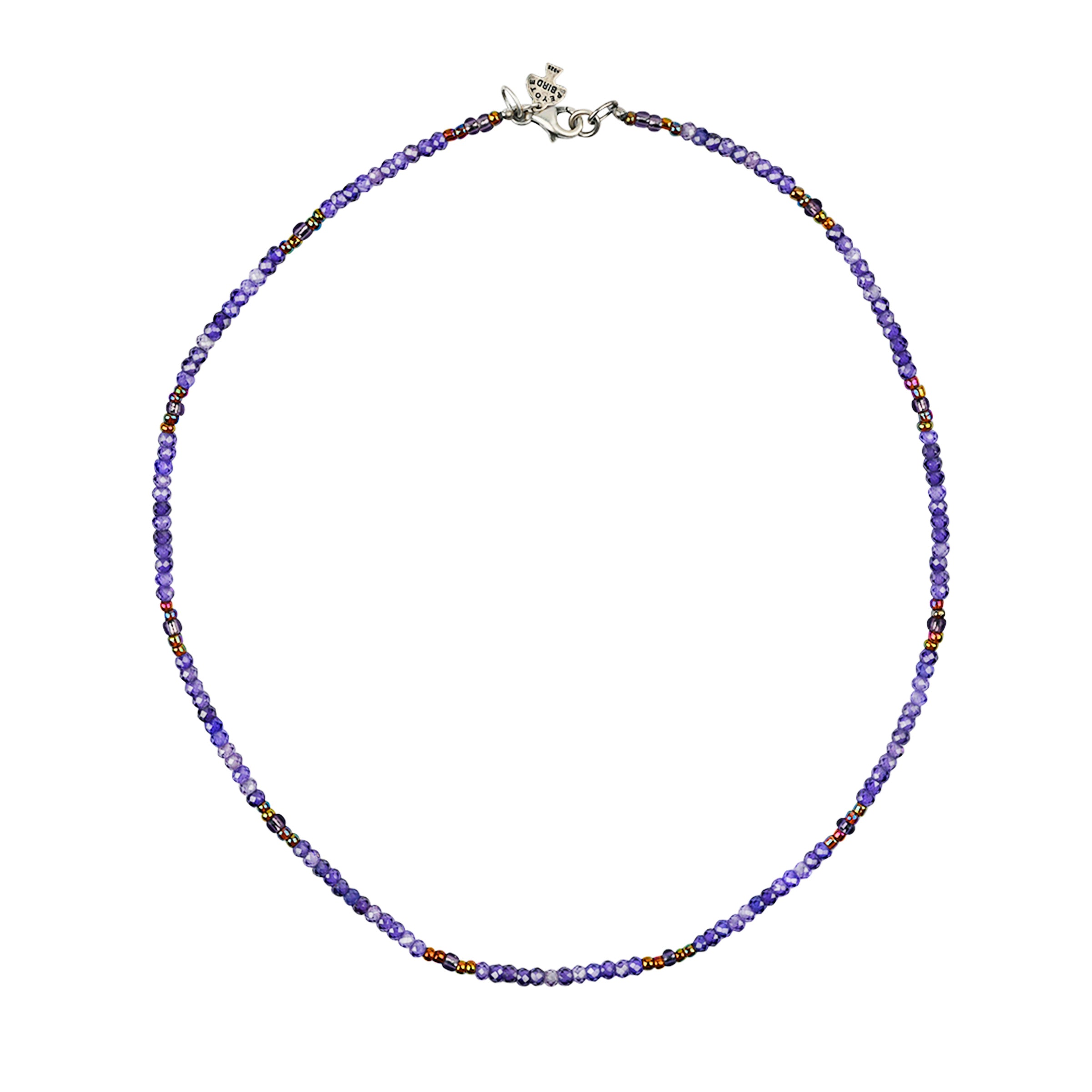Blue and violet tone beads with copper pops of color on beaded necklace with sterling silver lobster claw closure.