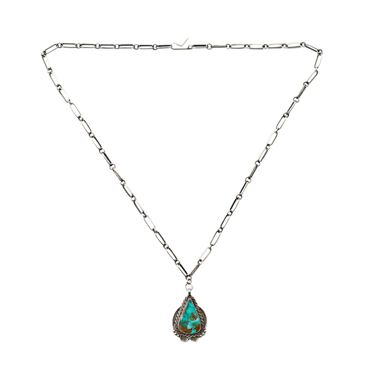 A vintage chain necklace featuring a teardrop pendant of blue turquoise set in sterling silver