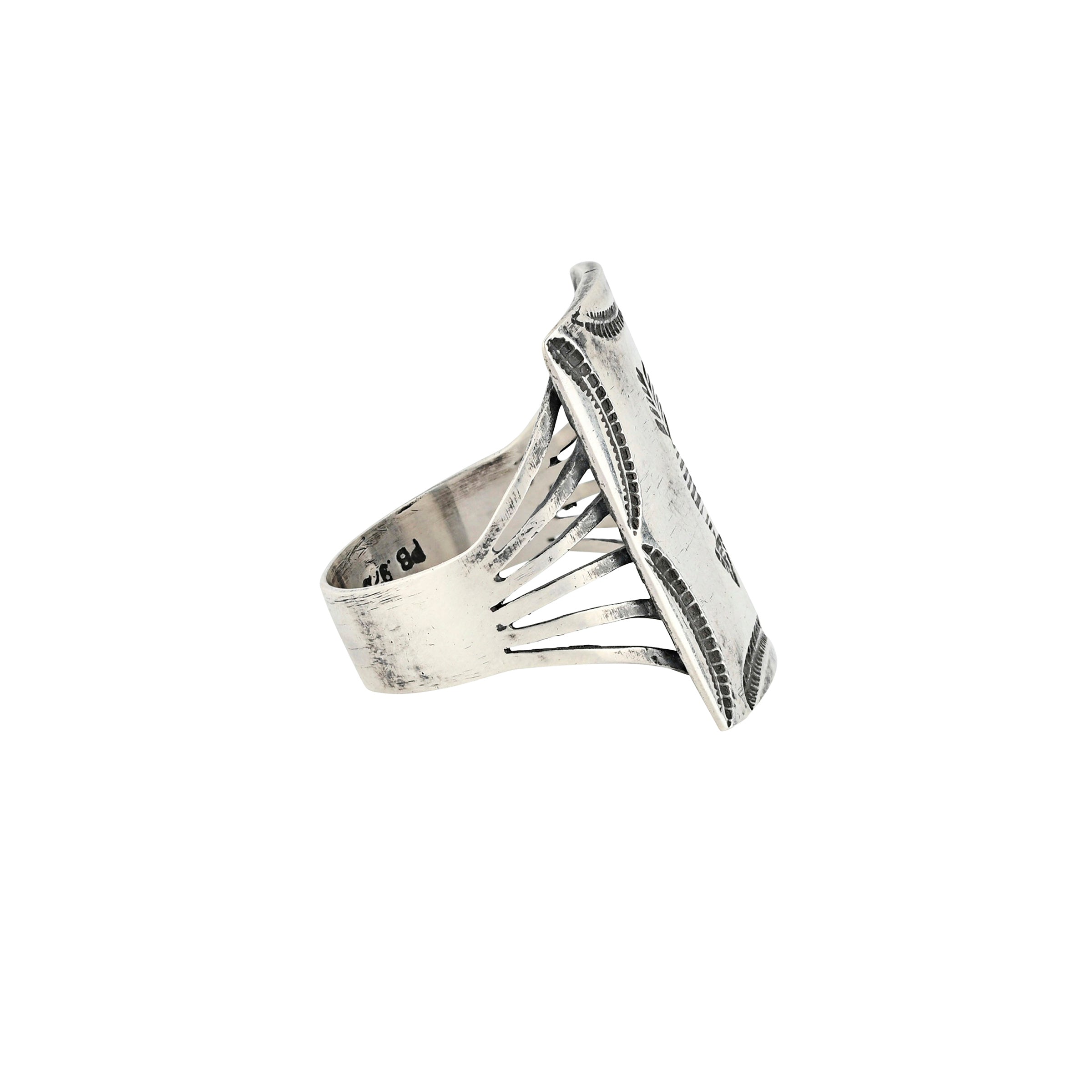 Sterling silver shield ring with leaf design on the border and a stamped arrow in the center.