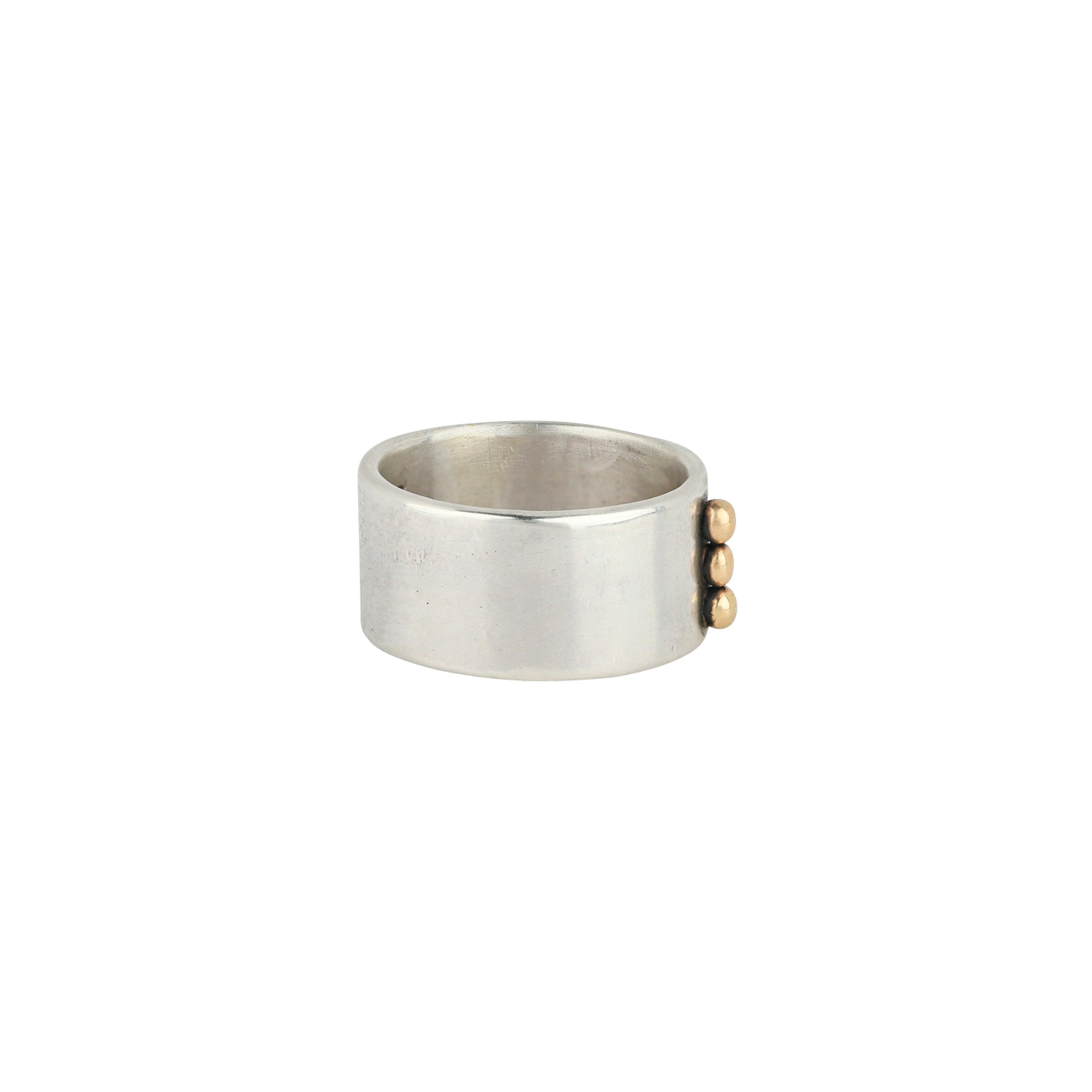 Sterling Silver ring featuring three gold studs handcrafted by Dennis Hogan