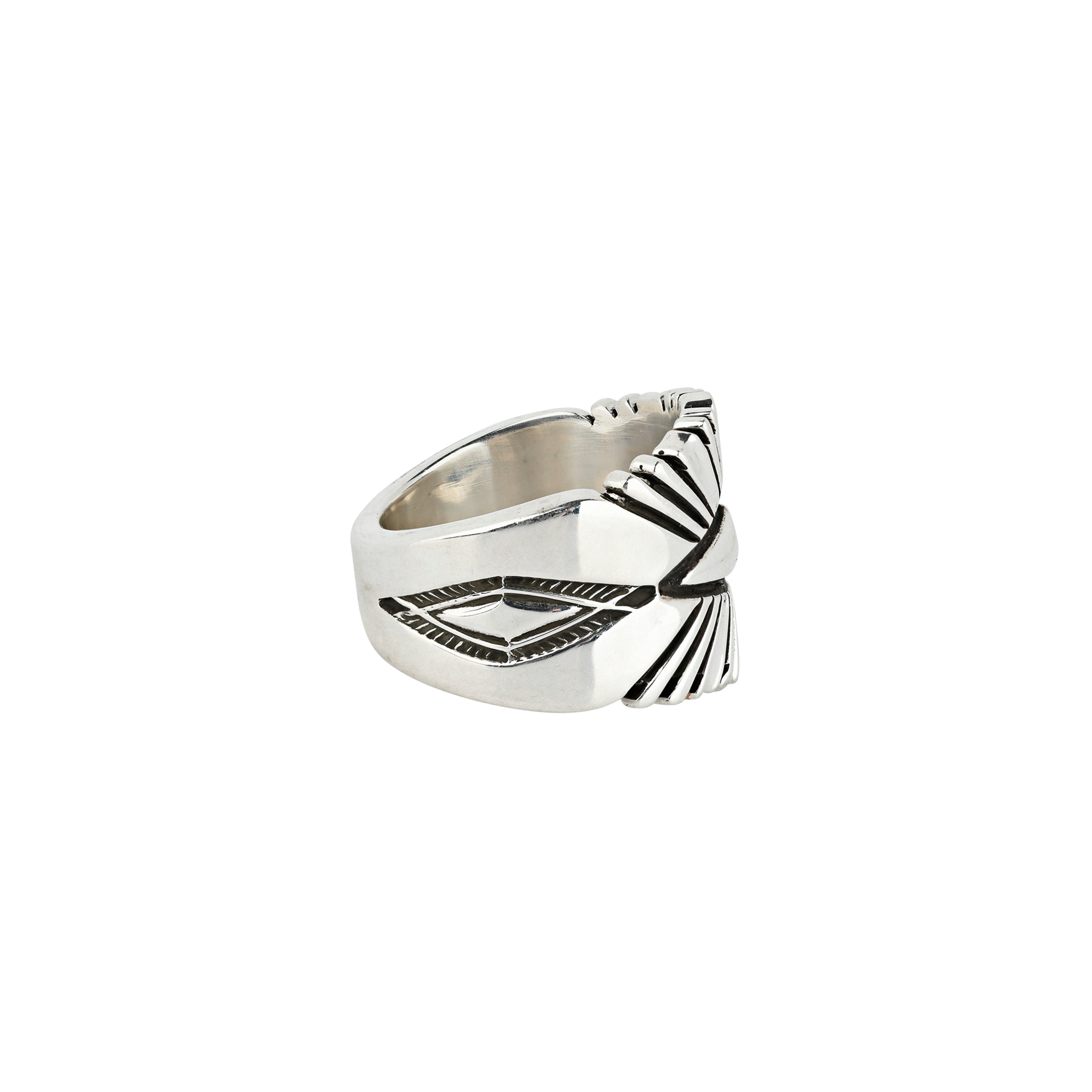 A sterling silver statement ring featuring a sleek diamond shape as the centerpiece with beams radiating from the center