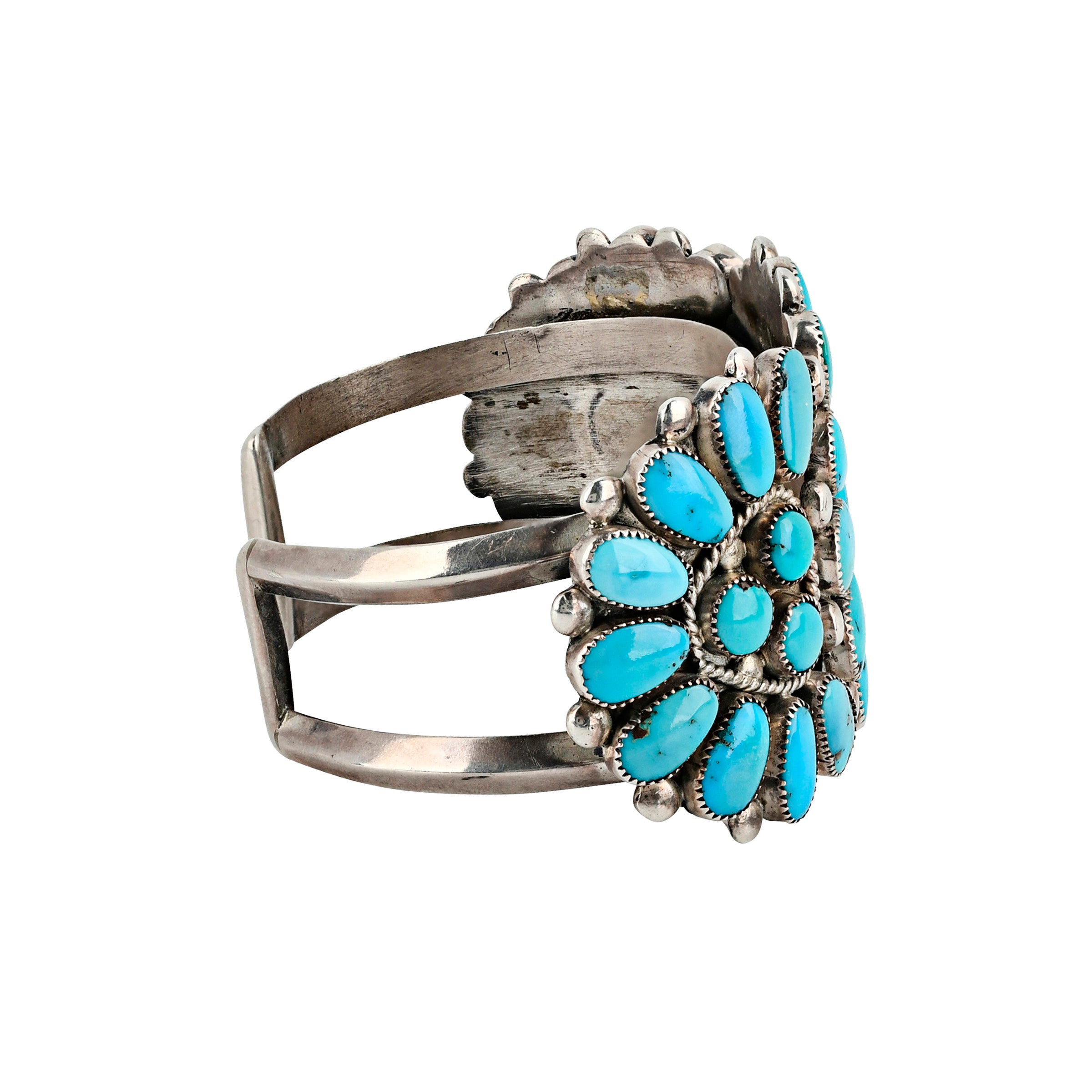 Flower motif in turquoise cuff side view