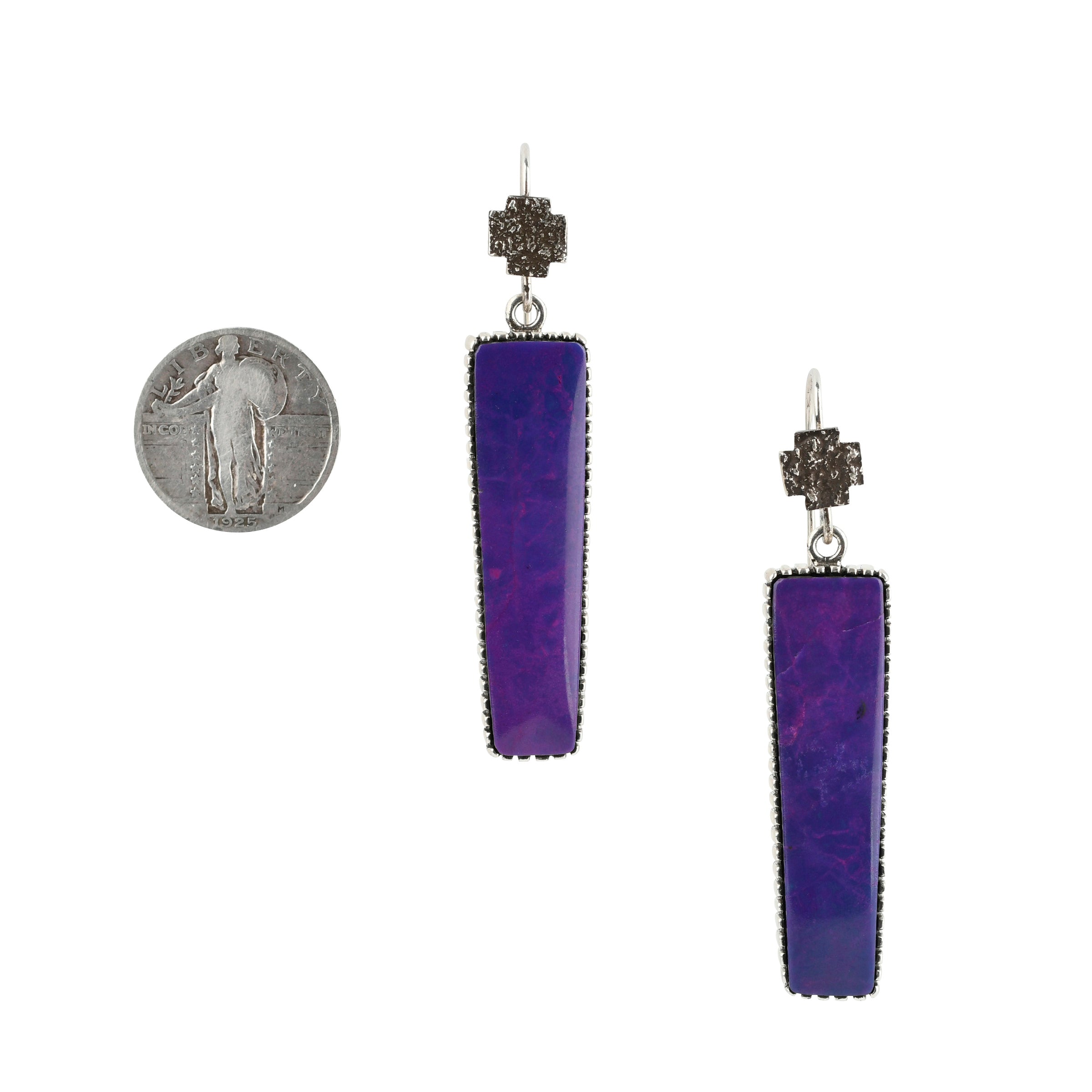 Sugalite drop earrings with cross toppers on sterling silver ear wires next to coin for scale.