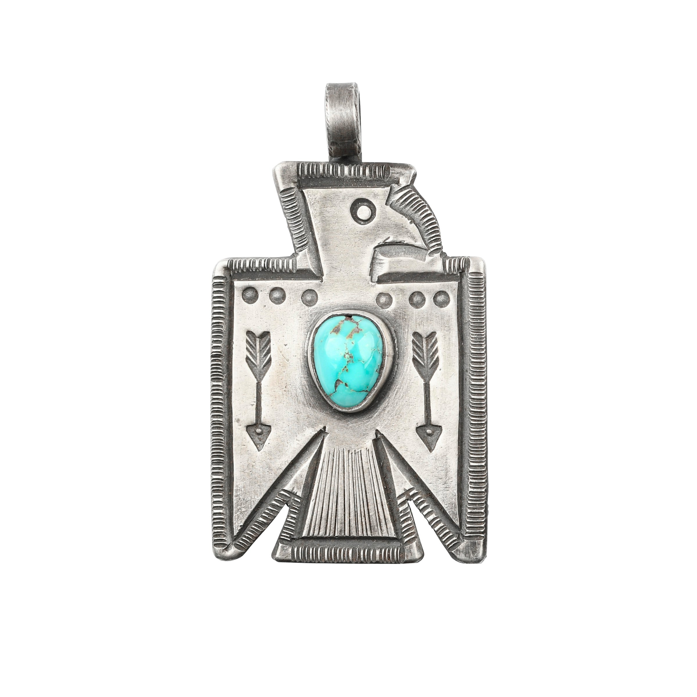 Ingot coin silver pendant with turquoise stone in the shape of a thunderbird.