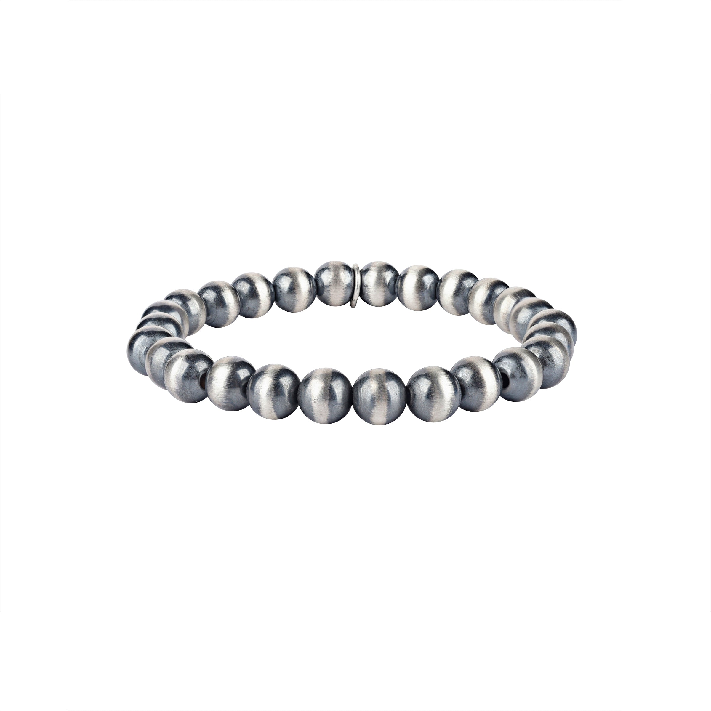 A stretch bracelet featuring round sterling silver beads representing the 'Desert Pearl' style.