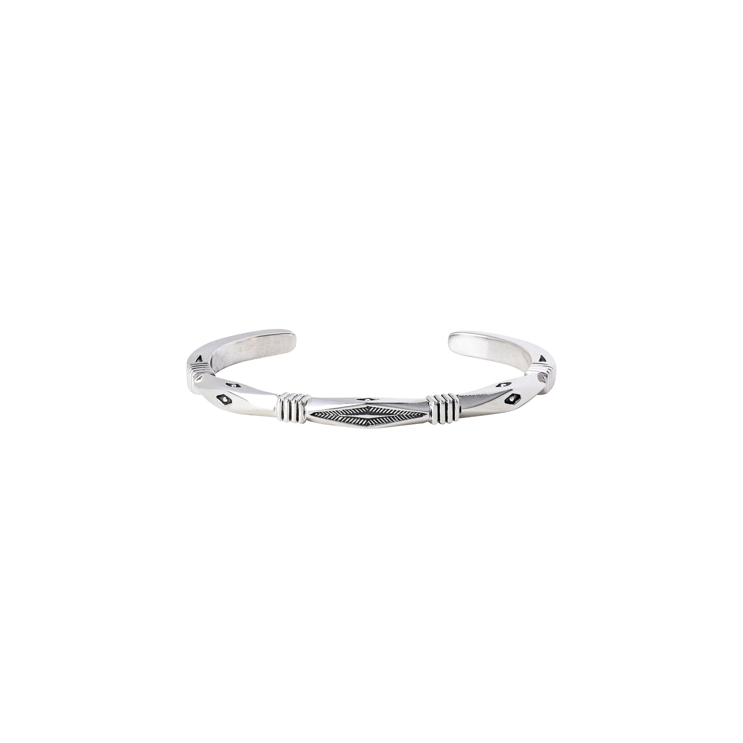 A Sterling silver hand-crafted cuff bracelet with intricate stamping and unique design.