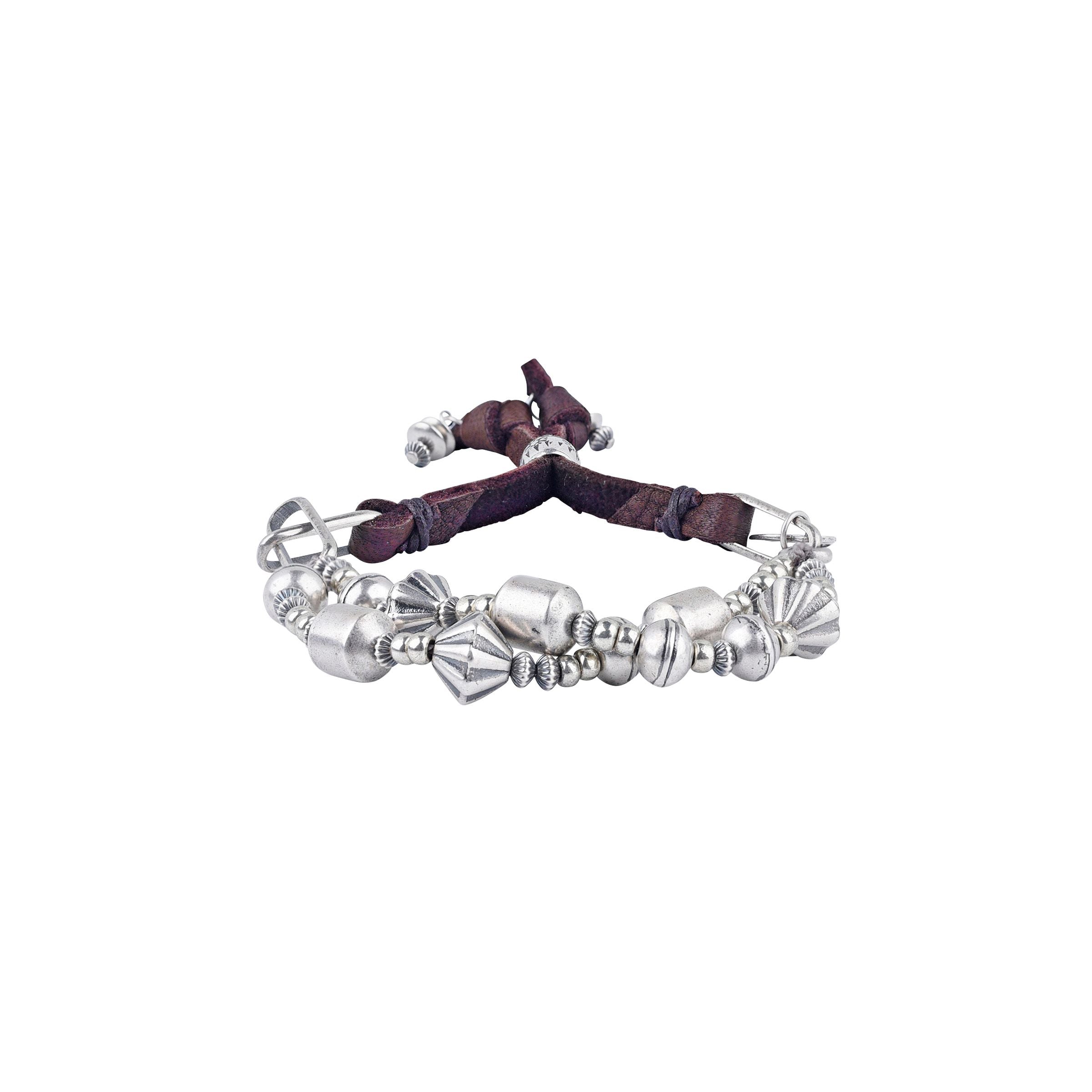 A sterling silver beaded bracelet with soft deerskin leather and a silver slider bead to make the bracelet adjustable in size.