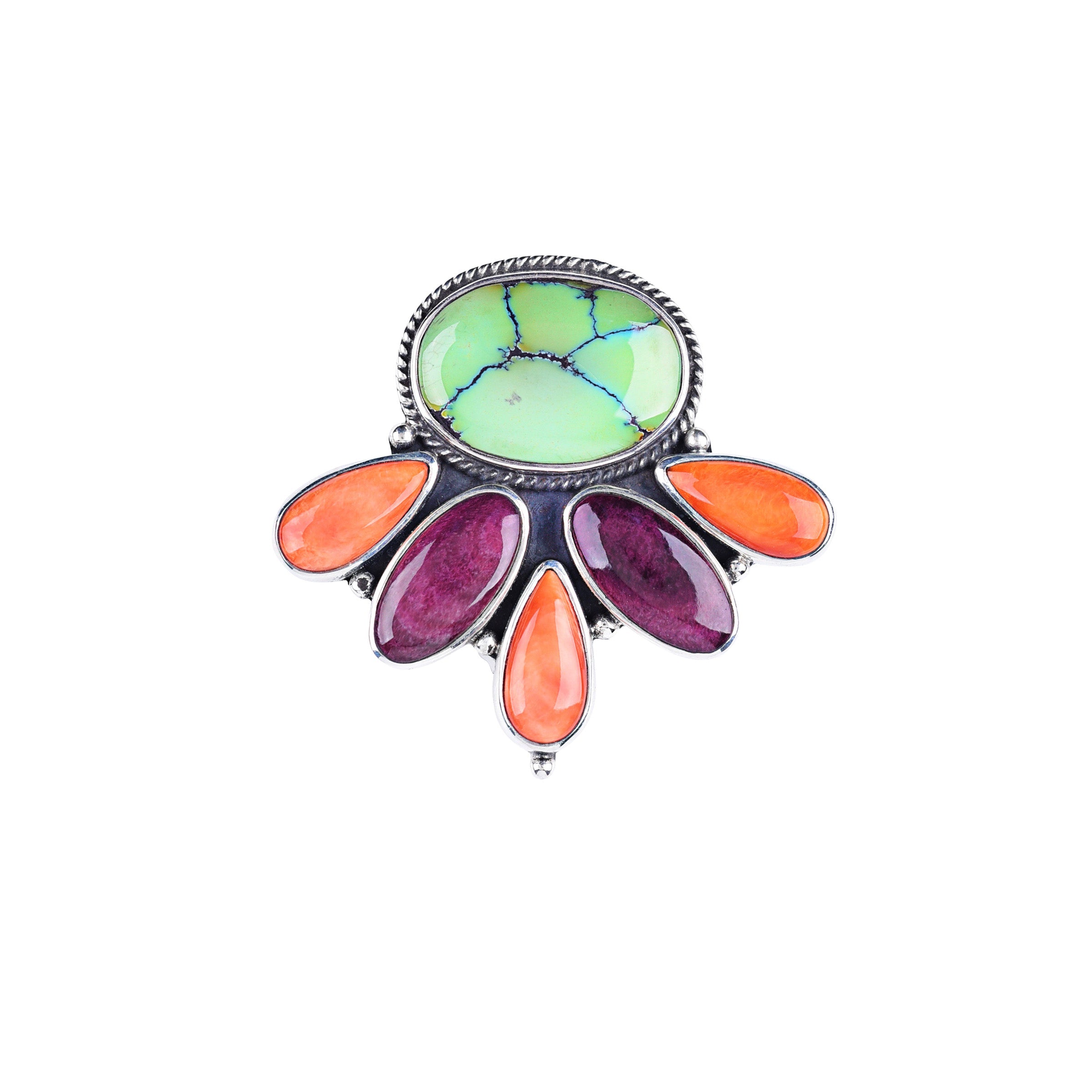 A colorful pin pendant with a central green turquoise stone, surrounded by sugilite and coral stones in a sterling silver setting.