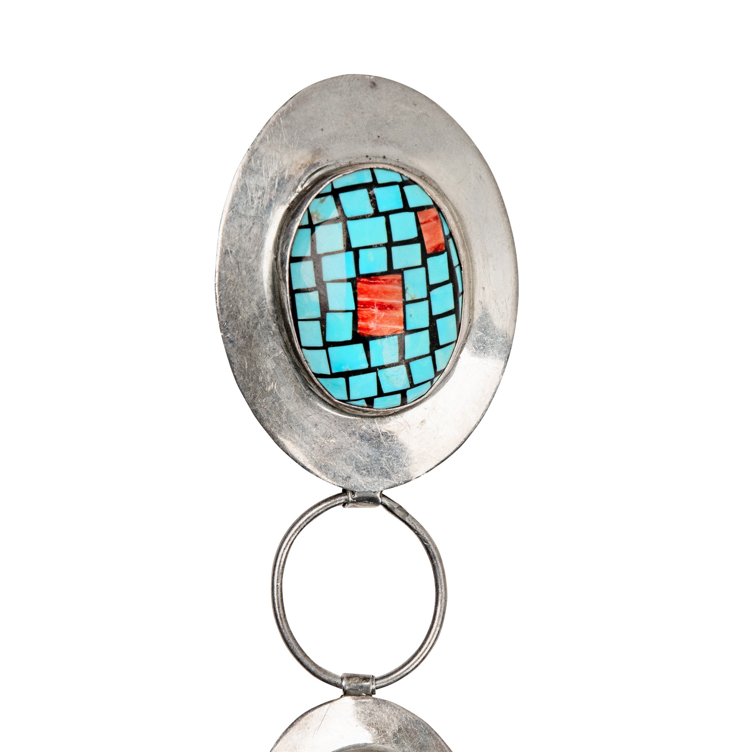 A sterling silver link belt with blue turquoise and red spiny oyster shell inlaid conchos .