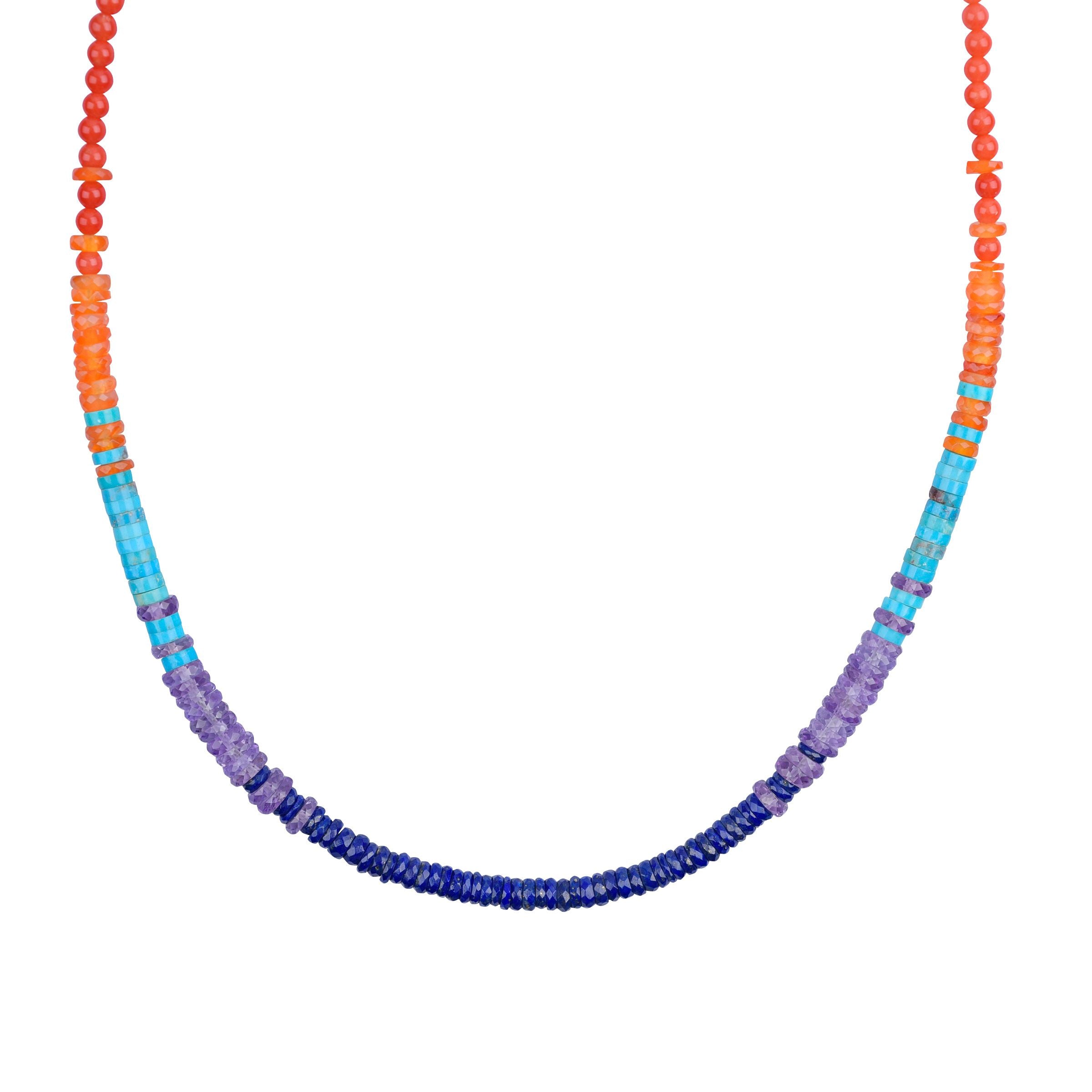 A Peyote Bird original necklace with a sterling silver chain, blue turquoise, amethyst, carnelian, lapis, red & orange coral, and chalcedony beads.