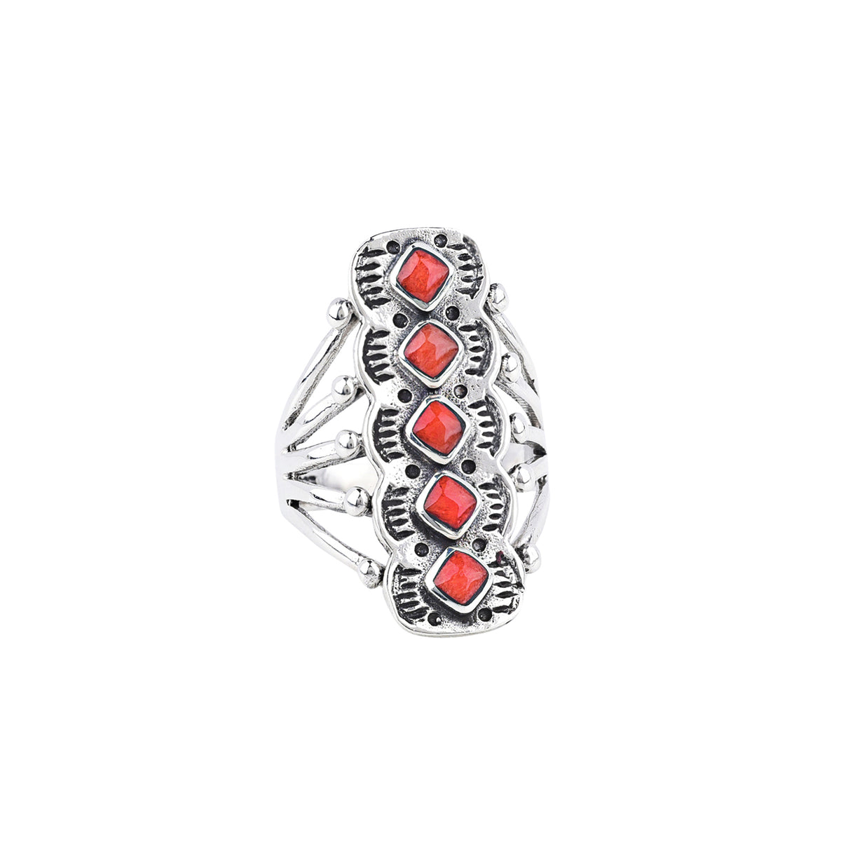 A sterling silver ring with red coral stones in an artistic triangular pattern and a split shank band.