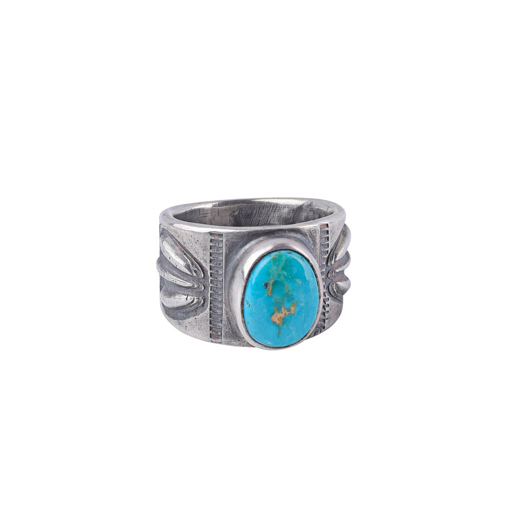 A blue and green turquoise stone ring with an ingot coin silver band, crafted by artisan Jesse Robbins.
