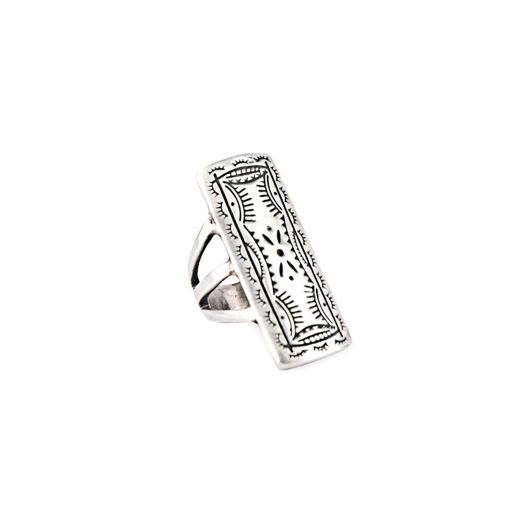A sterling silver stamped shield ring.