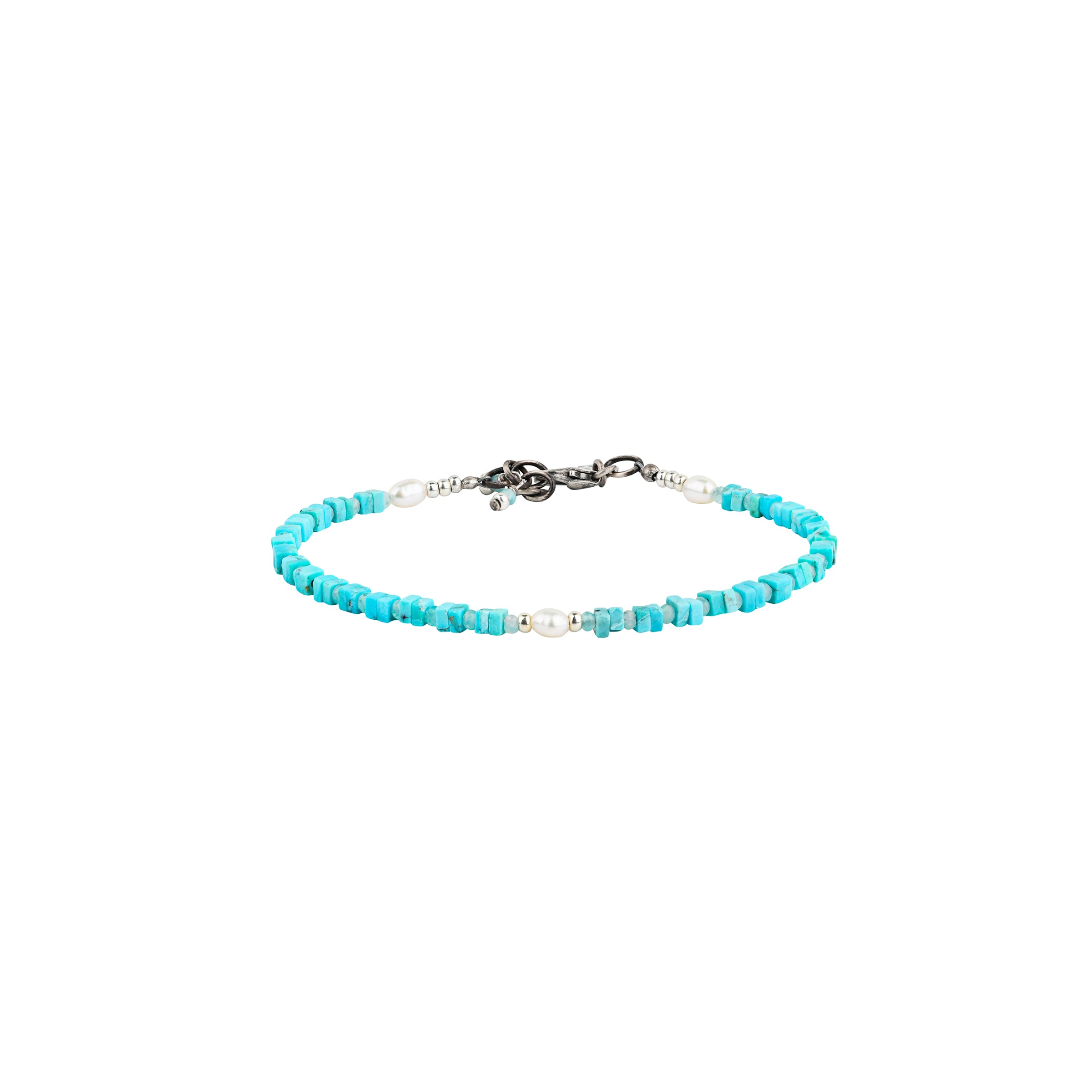 A Peyote Bird Original beaded bracelet featuring square Blue Turquoise beading spaced with Blue Peruvian Amazonite, and three Freshwater Pearls with Sterling Silver accents. This bracelet is adjustable from 17 inches to 17.75 inches.