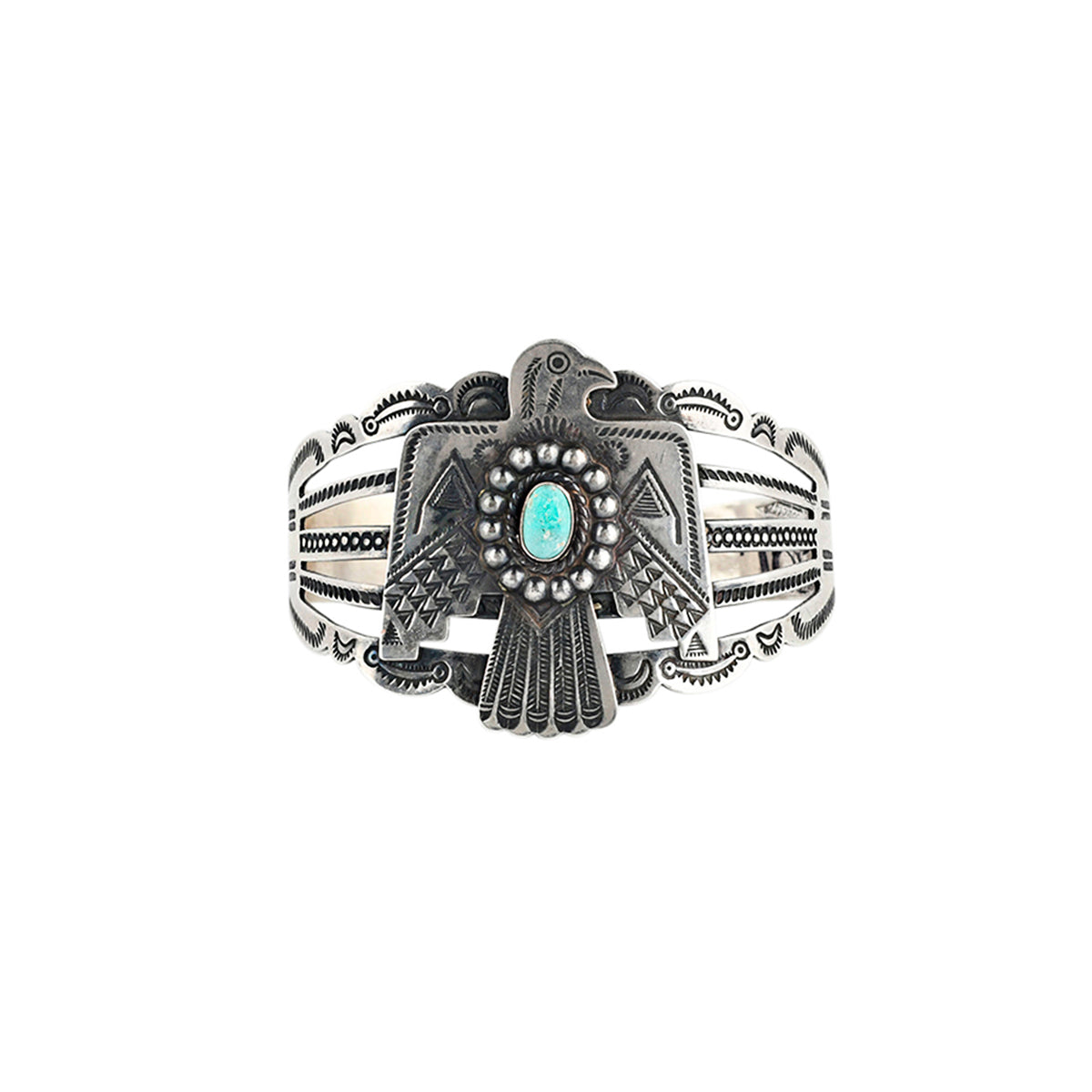 A Sterling Silver Cuff from the Vintage Collection of Peyote Bird Designs, features a large Thunderbird crafted in stamped Sterling Silver with a set Blue Turquoise stone as the centerpiece.