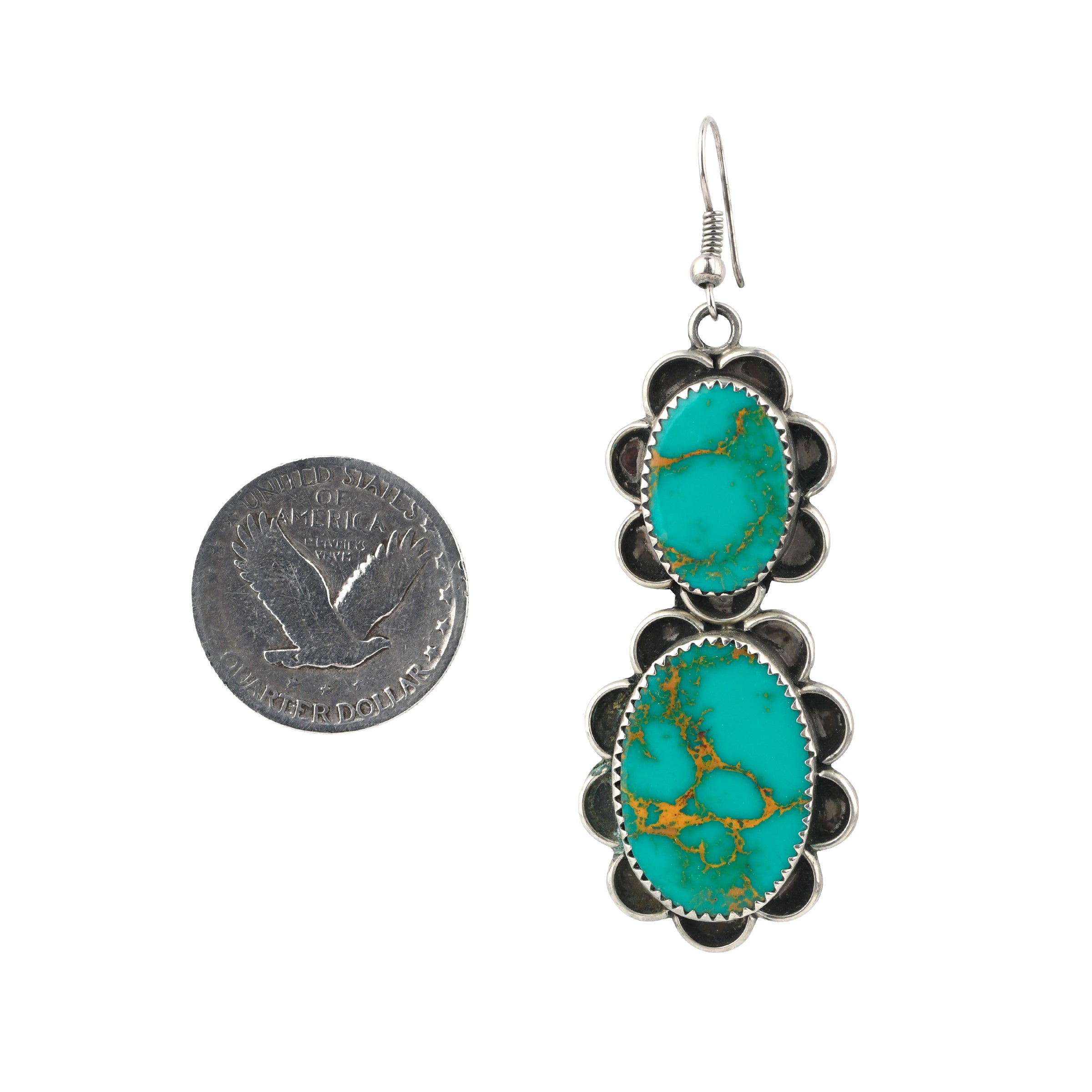 Vintage Navajo dangle earrings featuring sterling silver and natural green Fox turquoise.