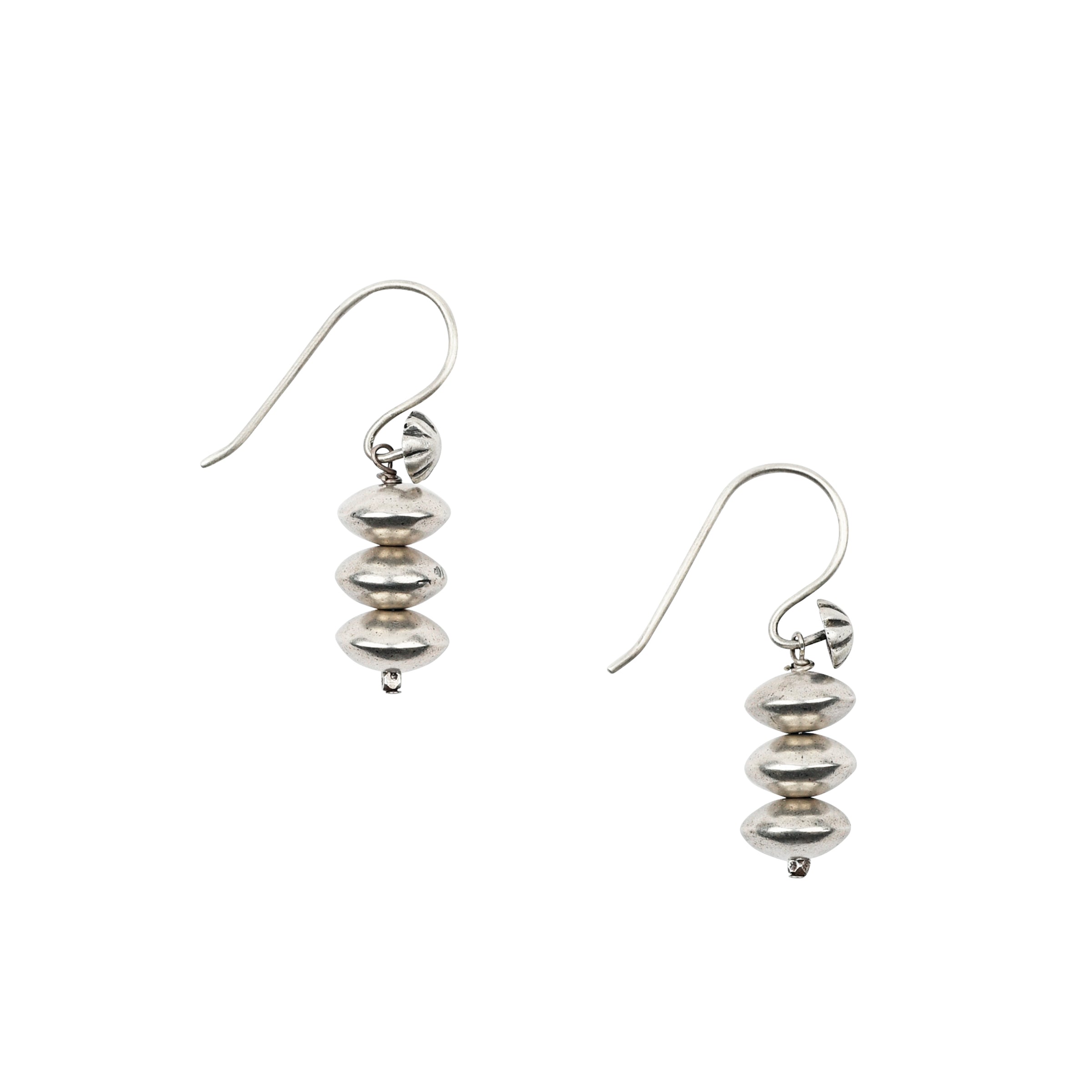 A pair of sterling silver, beaded, handcrafted earrings strung with vintage inspired beading on unique ear wires adorned with concho studs