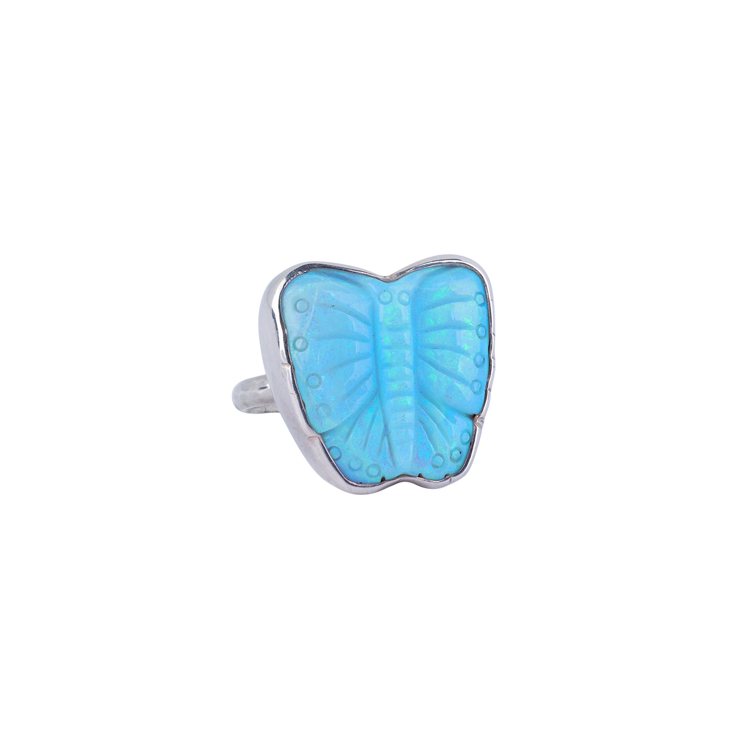 Turquoise carved into butterfly shape and detailing wrapped in sterling silver and single shank ring.