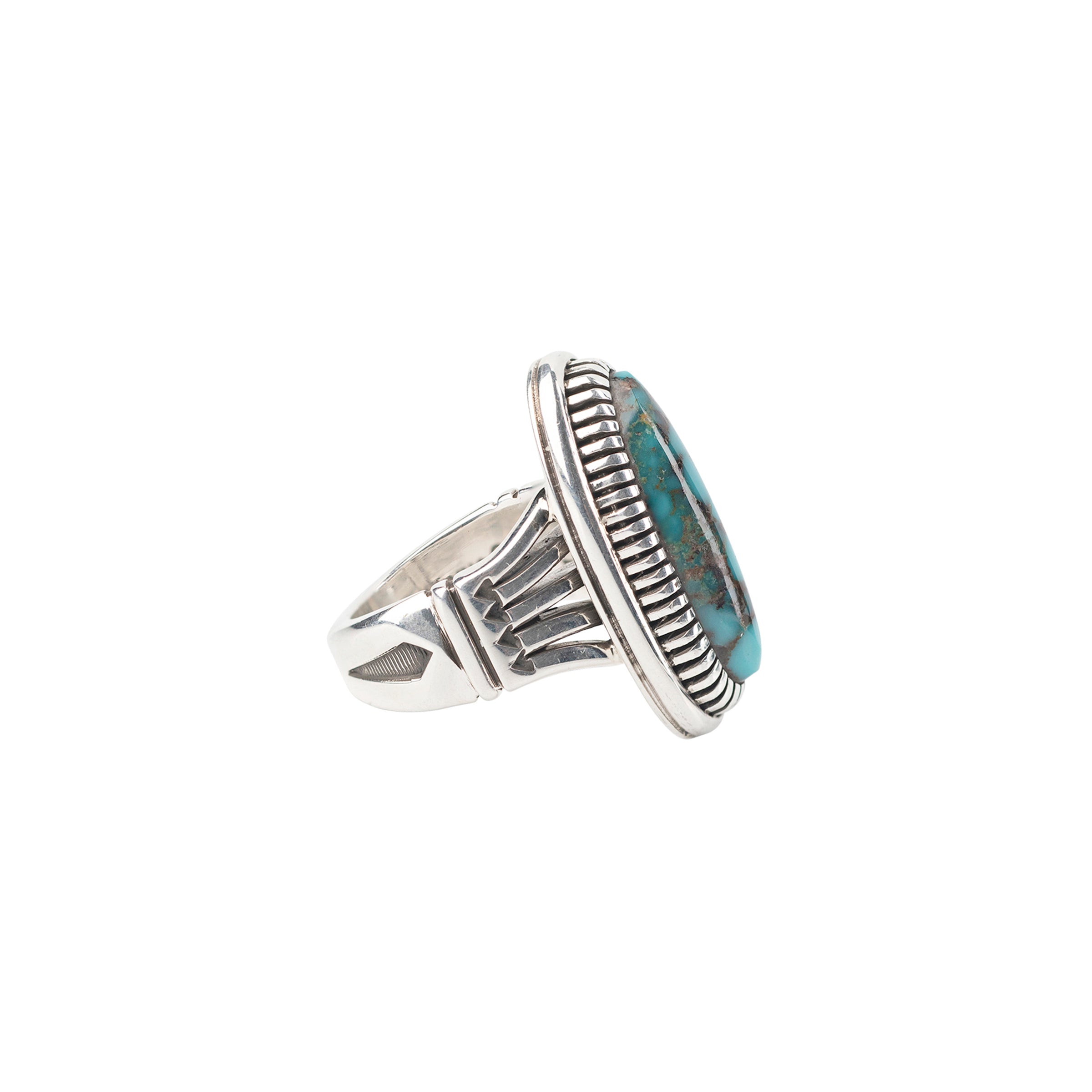 An oval-shaped blue matrix ring with a sterling silver band, featuring a bezel setting.
