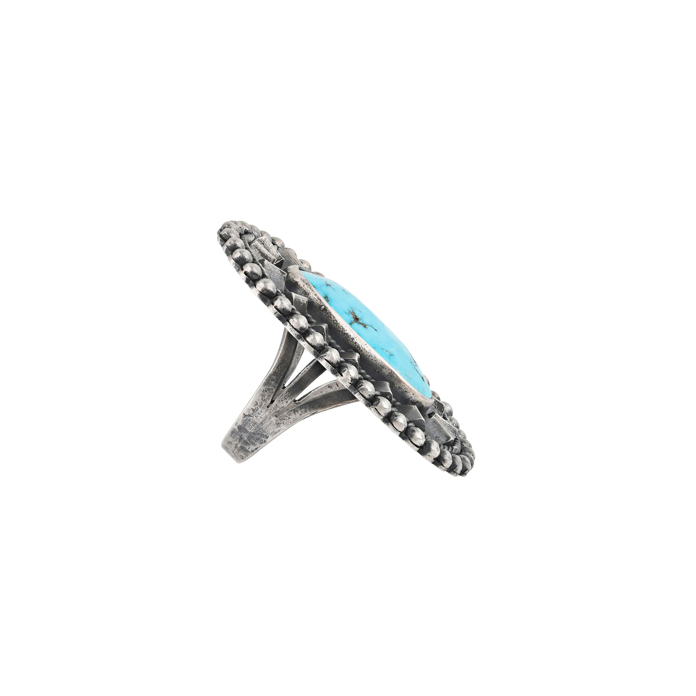 Silver ring with a blue stone on a white background. Nomad Tide Pool Ring (Size 7). Sleeping beauty turquoise, sterling silver, split shank bezel.