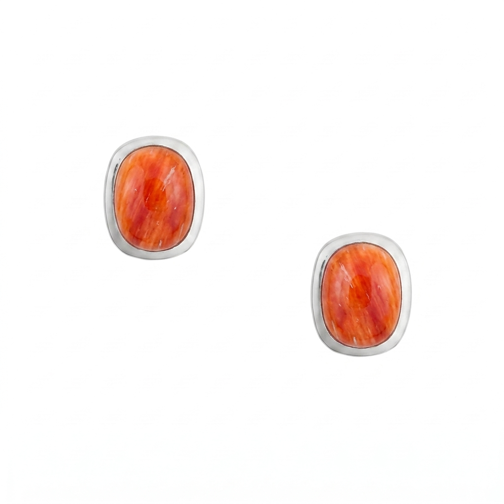 A pair of sterling silver stud earrings with rounded rectangular orange spiny oyster shell cabochons and comfort earring backs.
