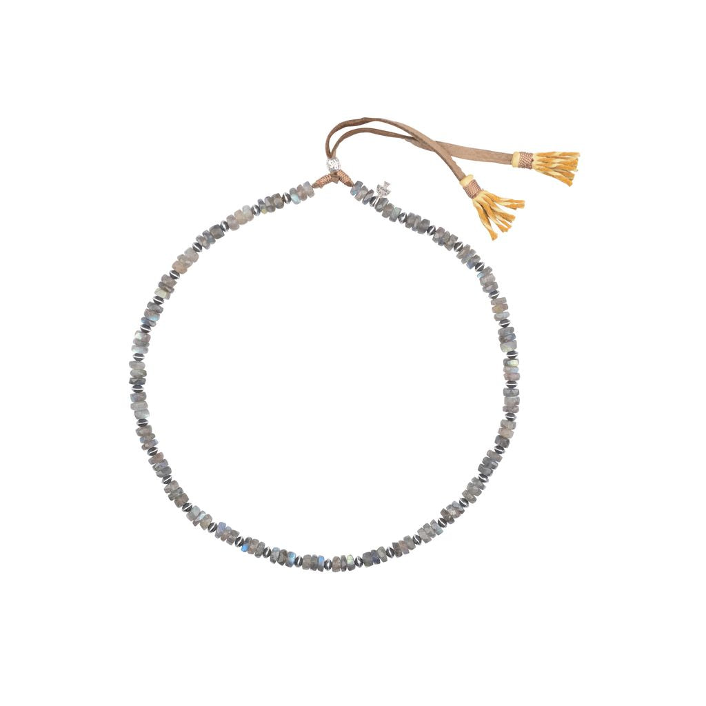 A sterling silver and labradorite hatband with a deerskin leather.