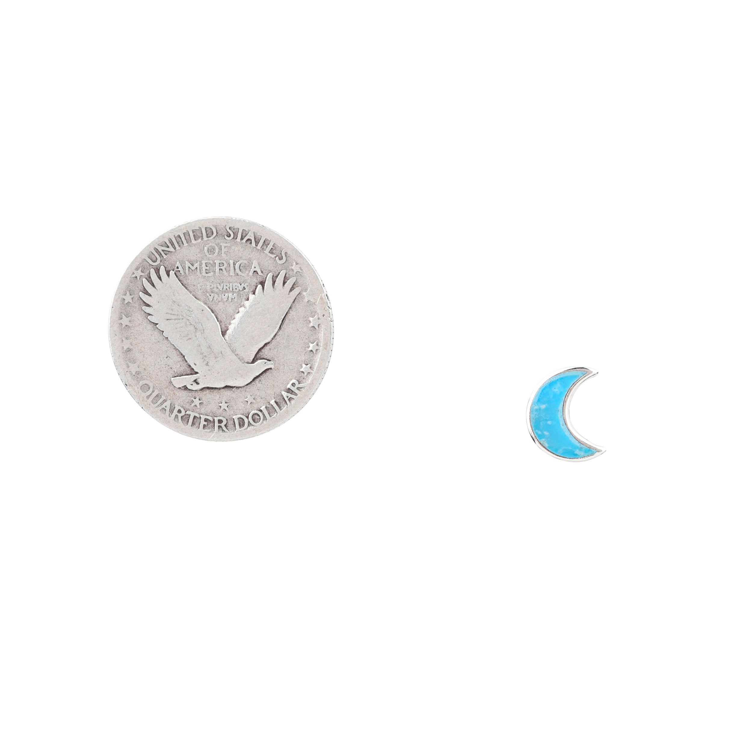 A pair of crescent-shaped stud earrings with turquoise stones, made of .925 sterling silver.