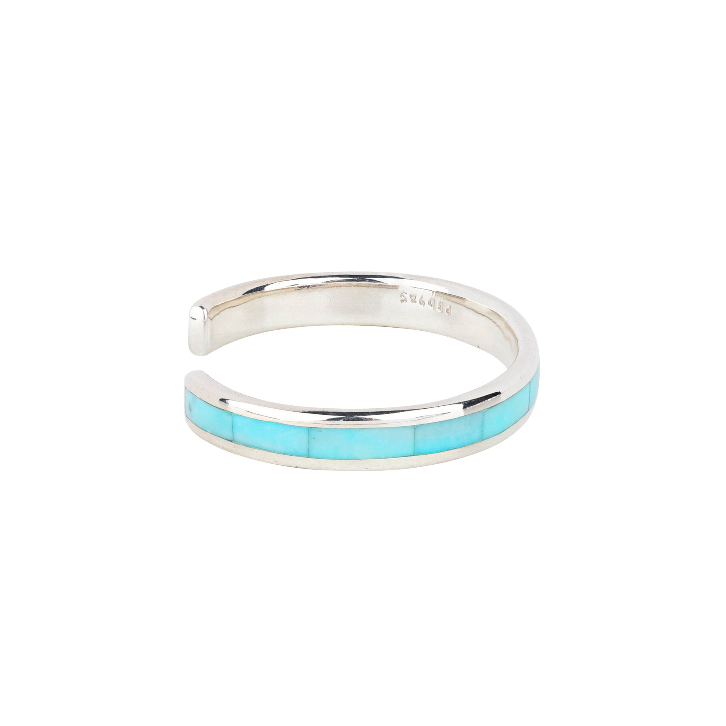The vintage inspired Trail cuff from our Bird and Arrow line that features sterling silver with blue turquoise stone inlay.