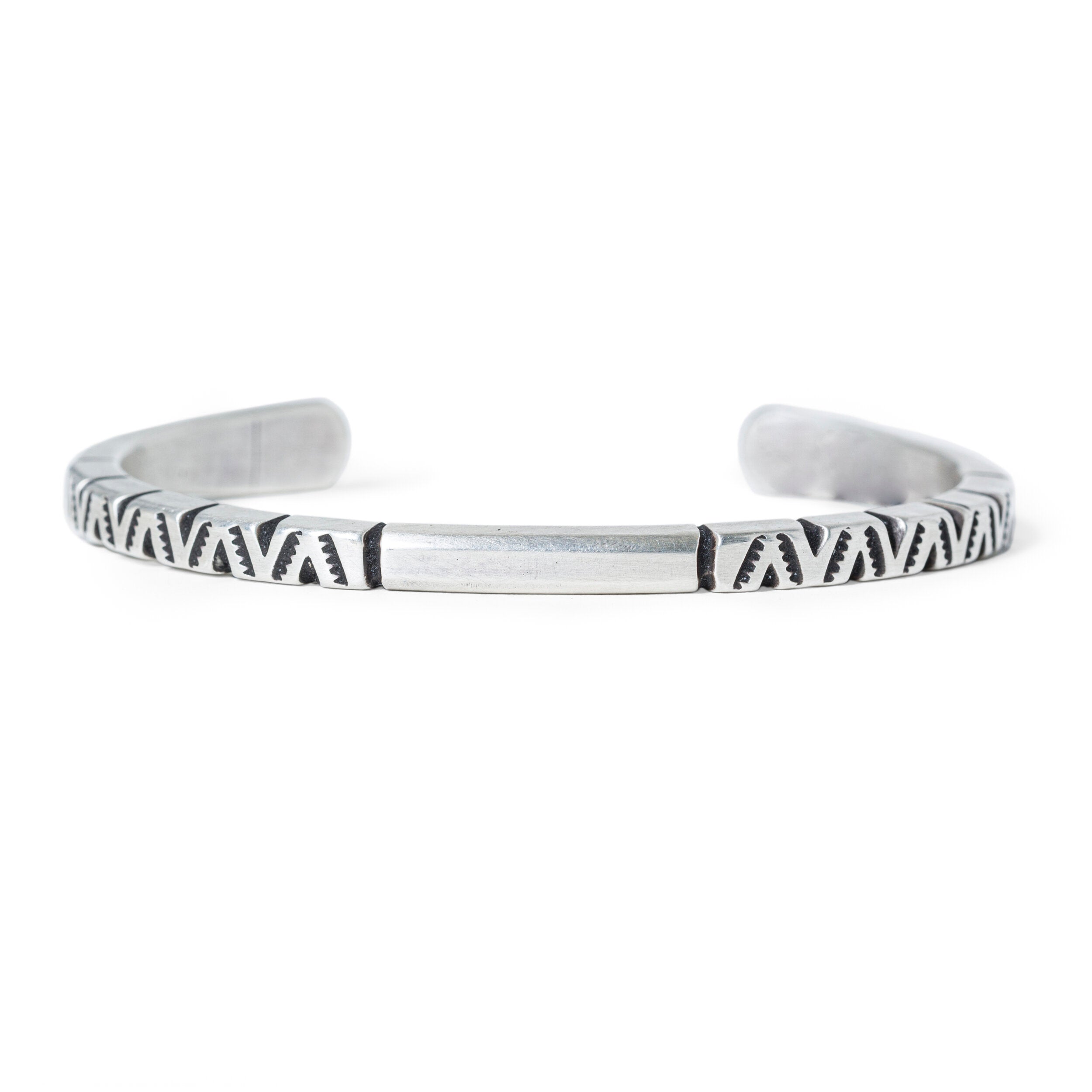 Sterling silver cuff from American artisan Alex Horst with unique engraving and stamping.
