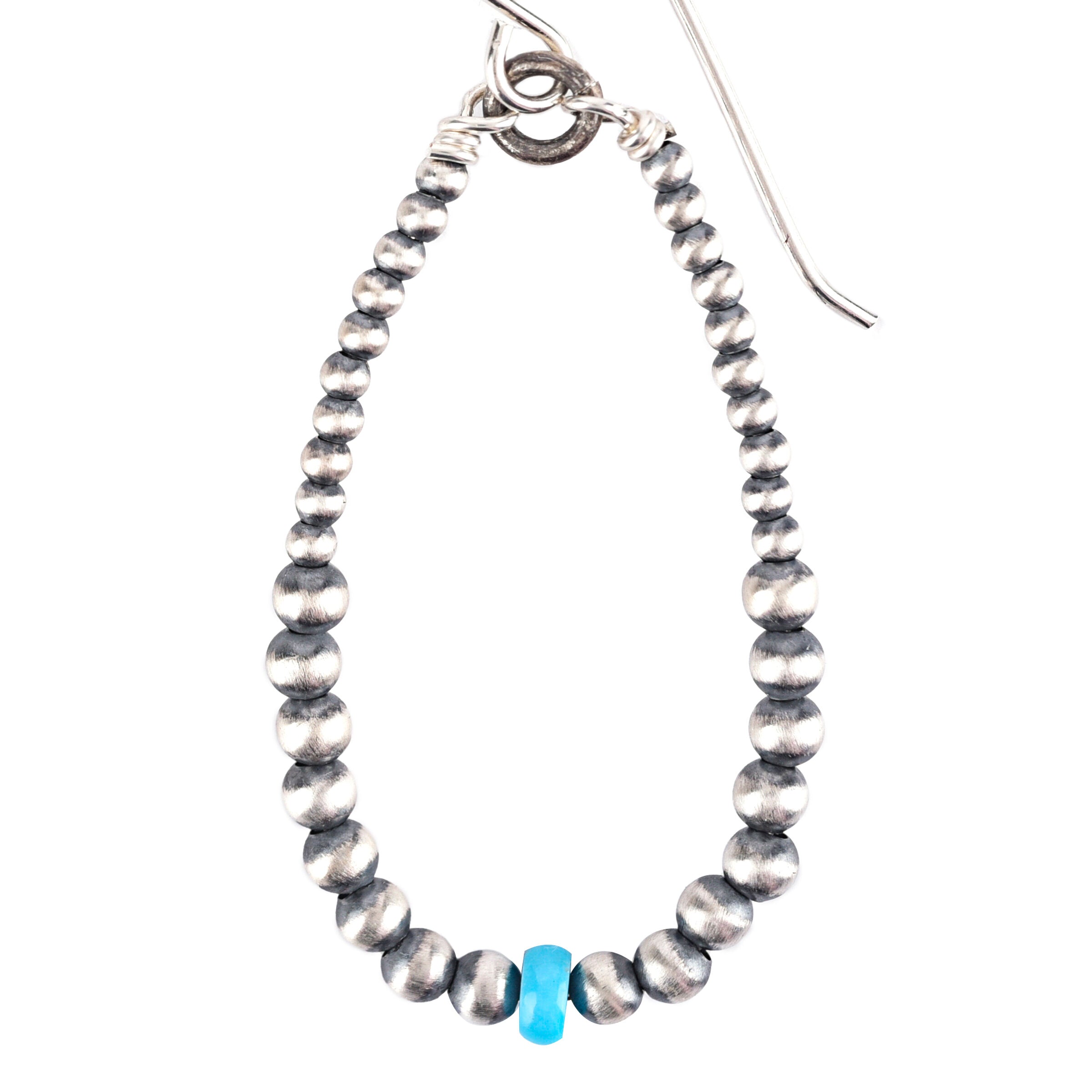 Sterling silver and blue turquoise dangle hoop earrings.