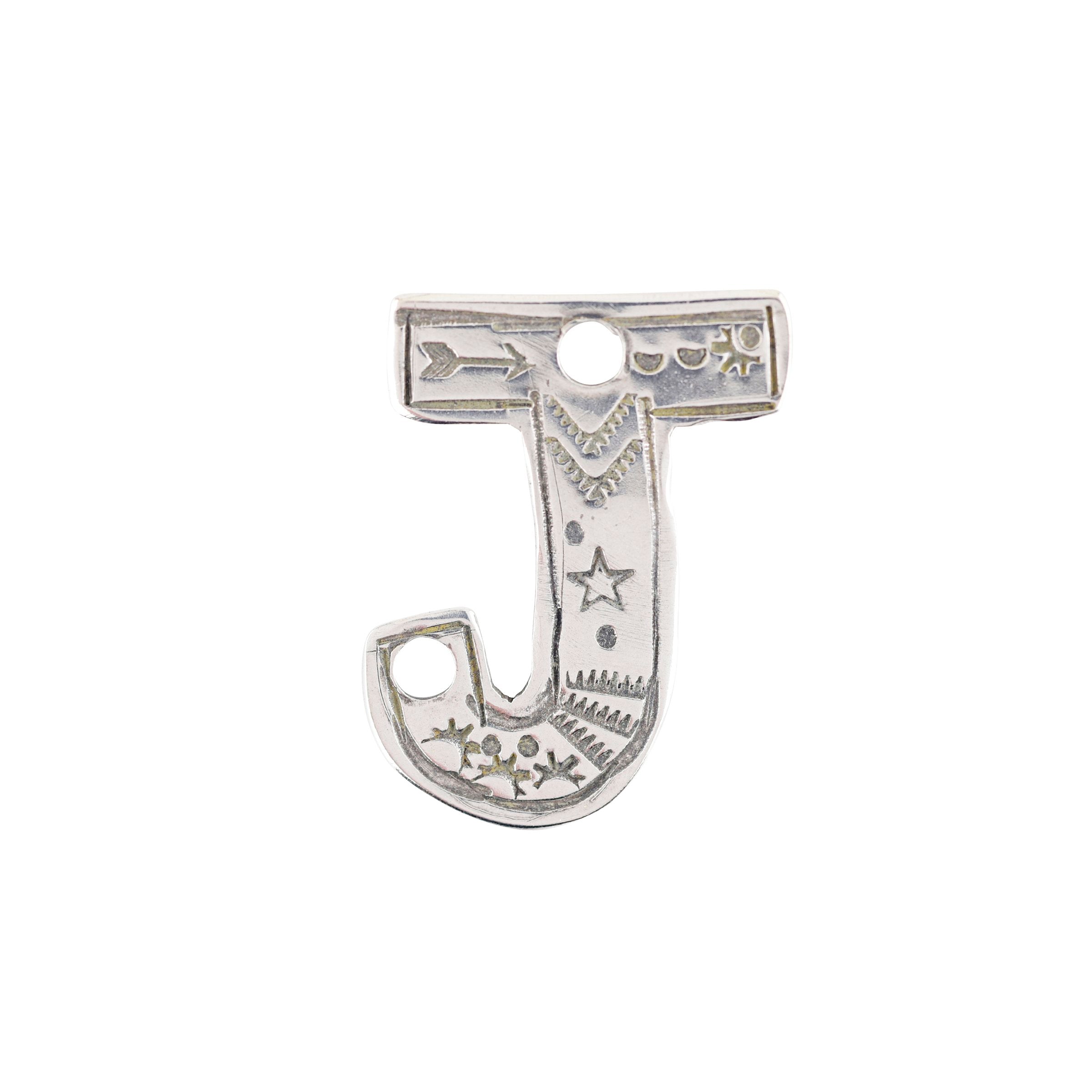 A sterling silver J Charm from artist Joe Eby that is a perfect addition to any hat or jacket.