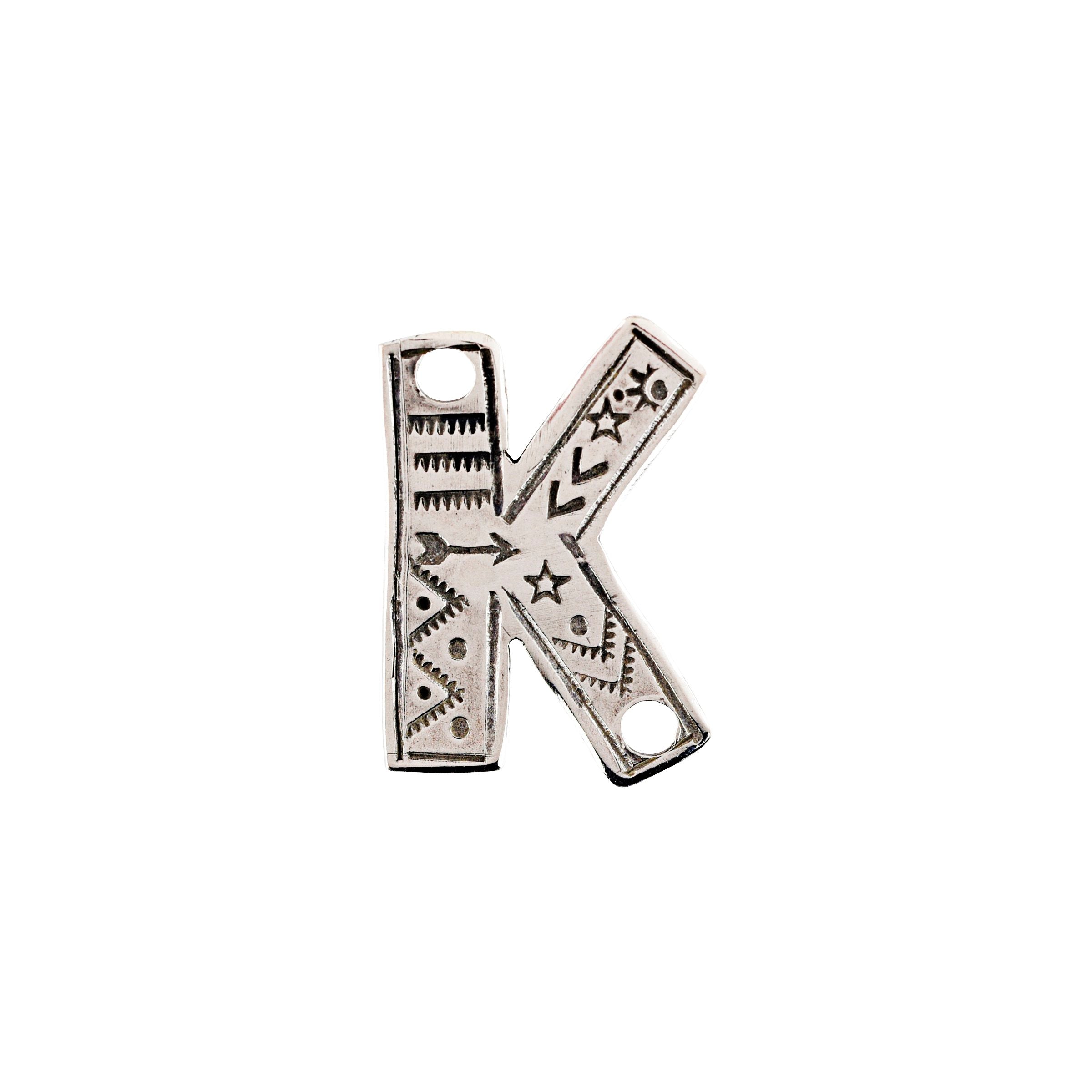 The stamped sterling silver K Charm rom Joe Eby is the perfect western addition to any hat or jacket.
