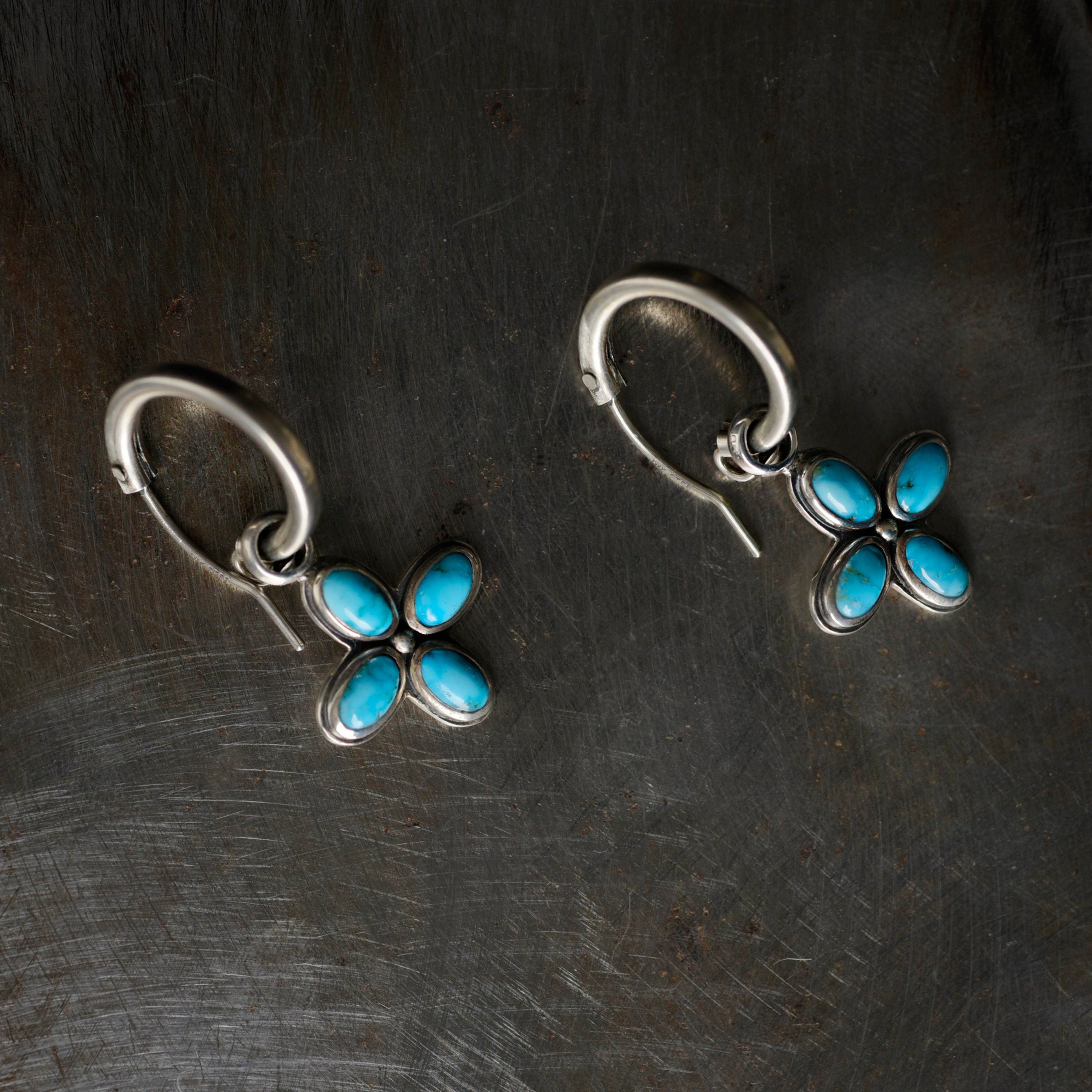 Single sided sterling silver flower petal earrings from New Mexican artist Dennis Hogan. Featuring Blue and Green Turquoise and Jet stones.