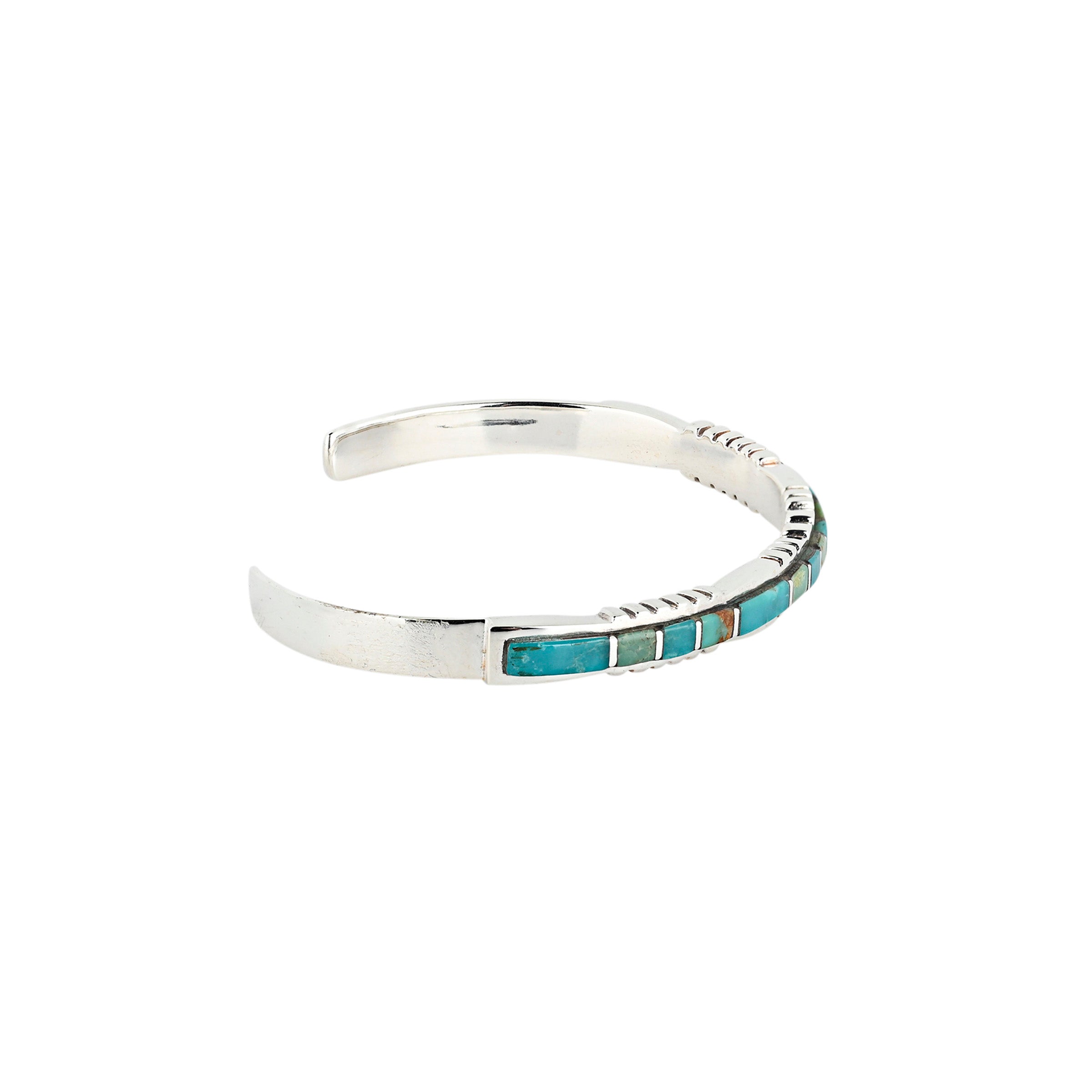 Sterling silver cuff with inlay stone detail in turquoise and green turquoise and detailing on top and bottom. side view