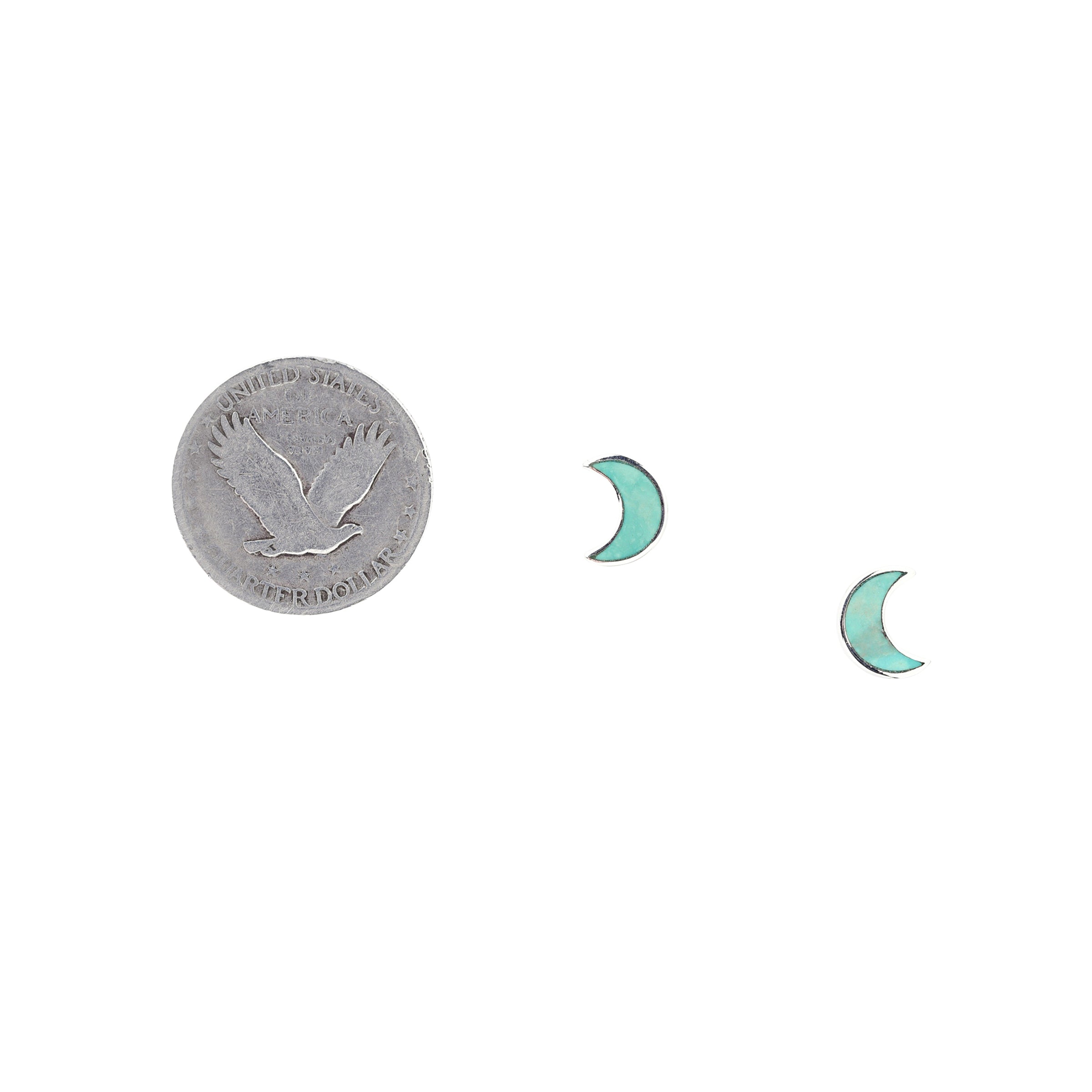 A pair of crescent-shaped stud earrings with turquoise stones, made of .925 sterling silver.