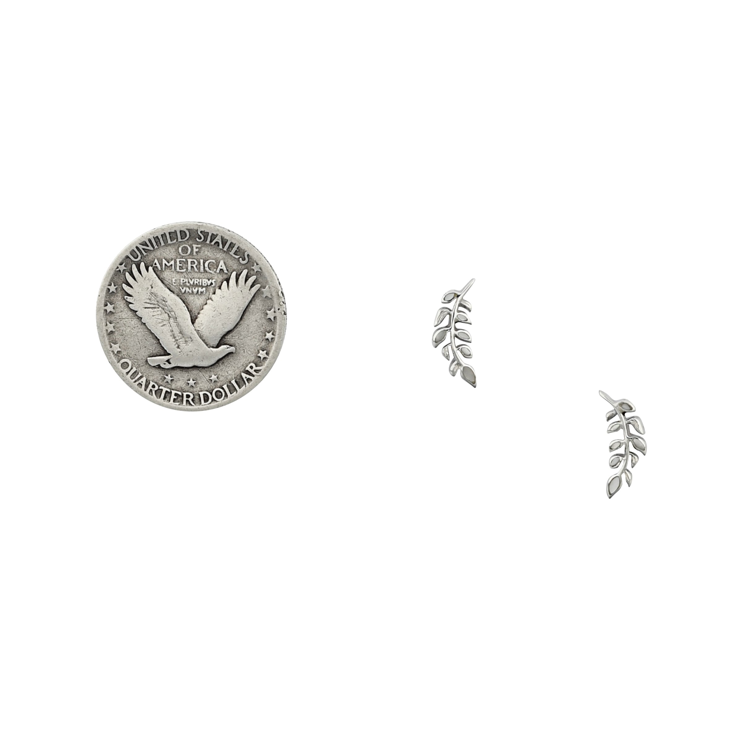 Sterling silver mother of pearl inlay earrings in leaf motif next to coin for scale. 