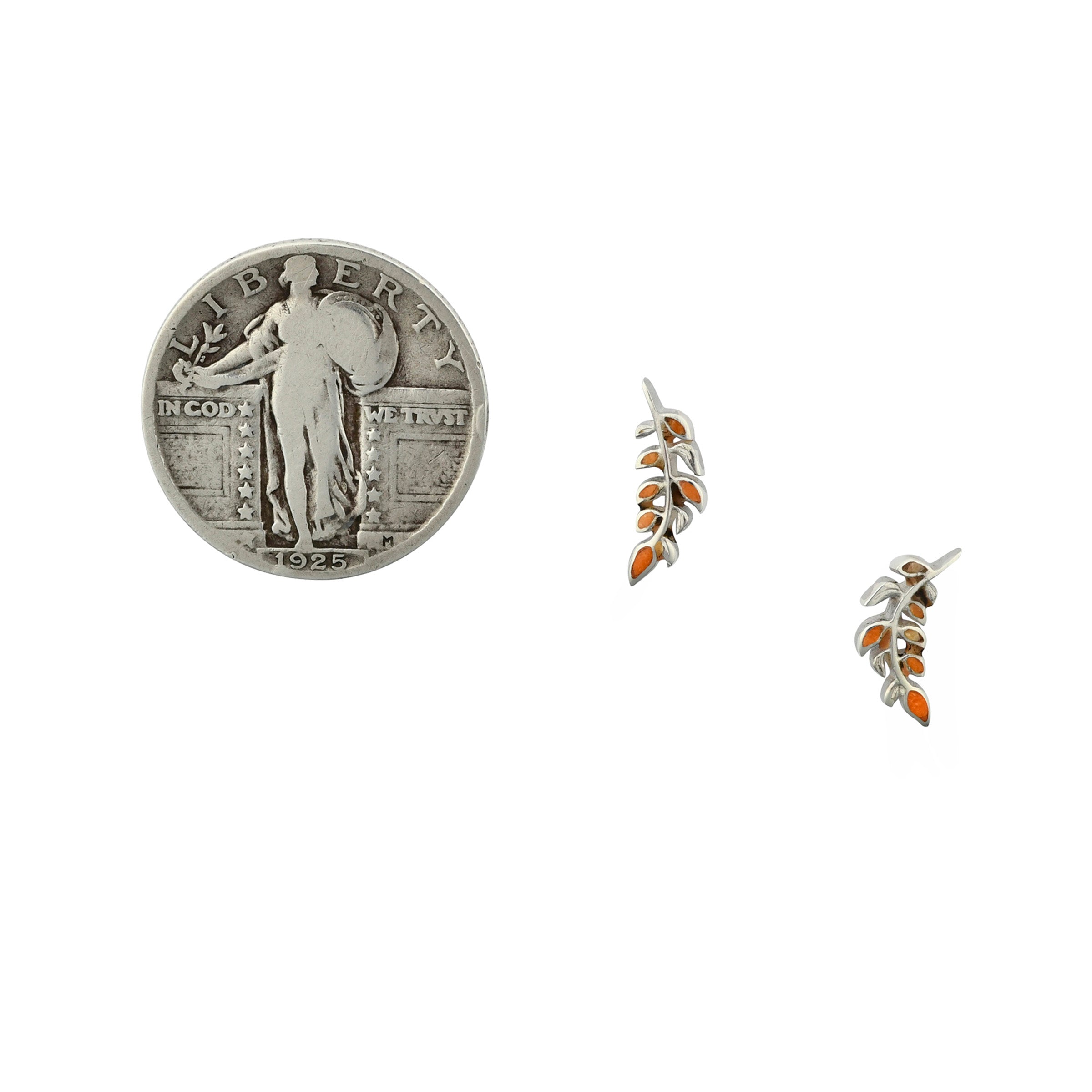 Sterling silver orange spiny oyster shell inlay earrings in leaf motif next to coin for scale.