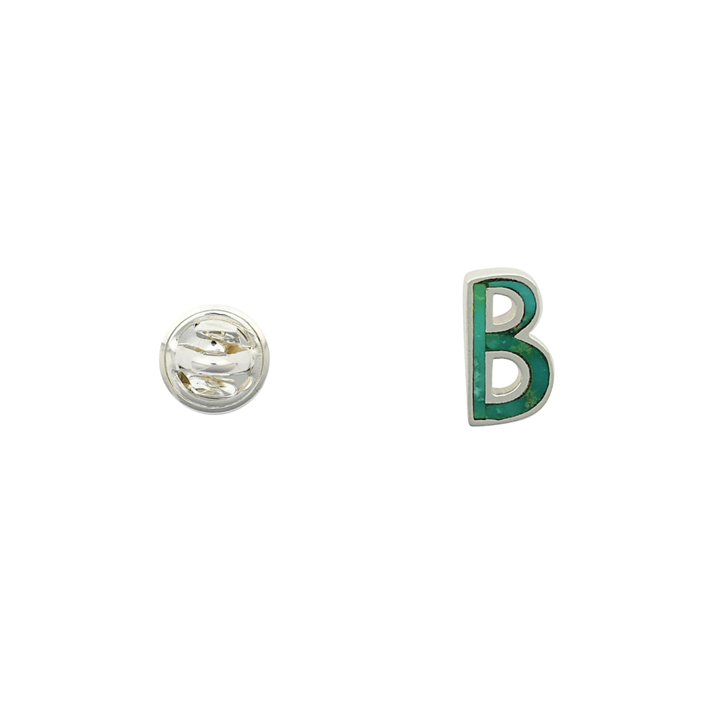 Green Turquoise letter pin B wrapped in sterling silver next to silver tack back. 