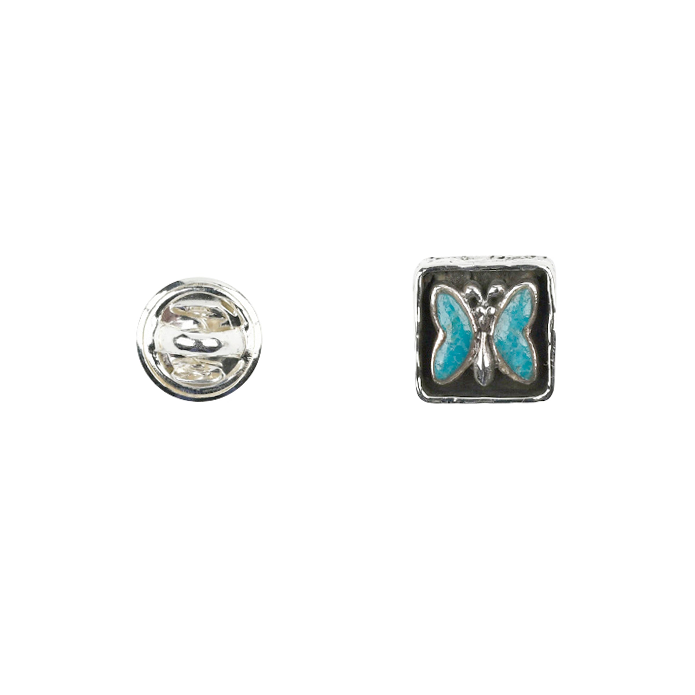 Sterling silver pin back and front with turquoise butterfly motif set in sterling silver square with oxidized sides around sunken butterfly. 