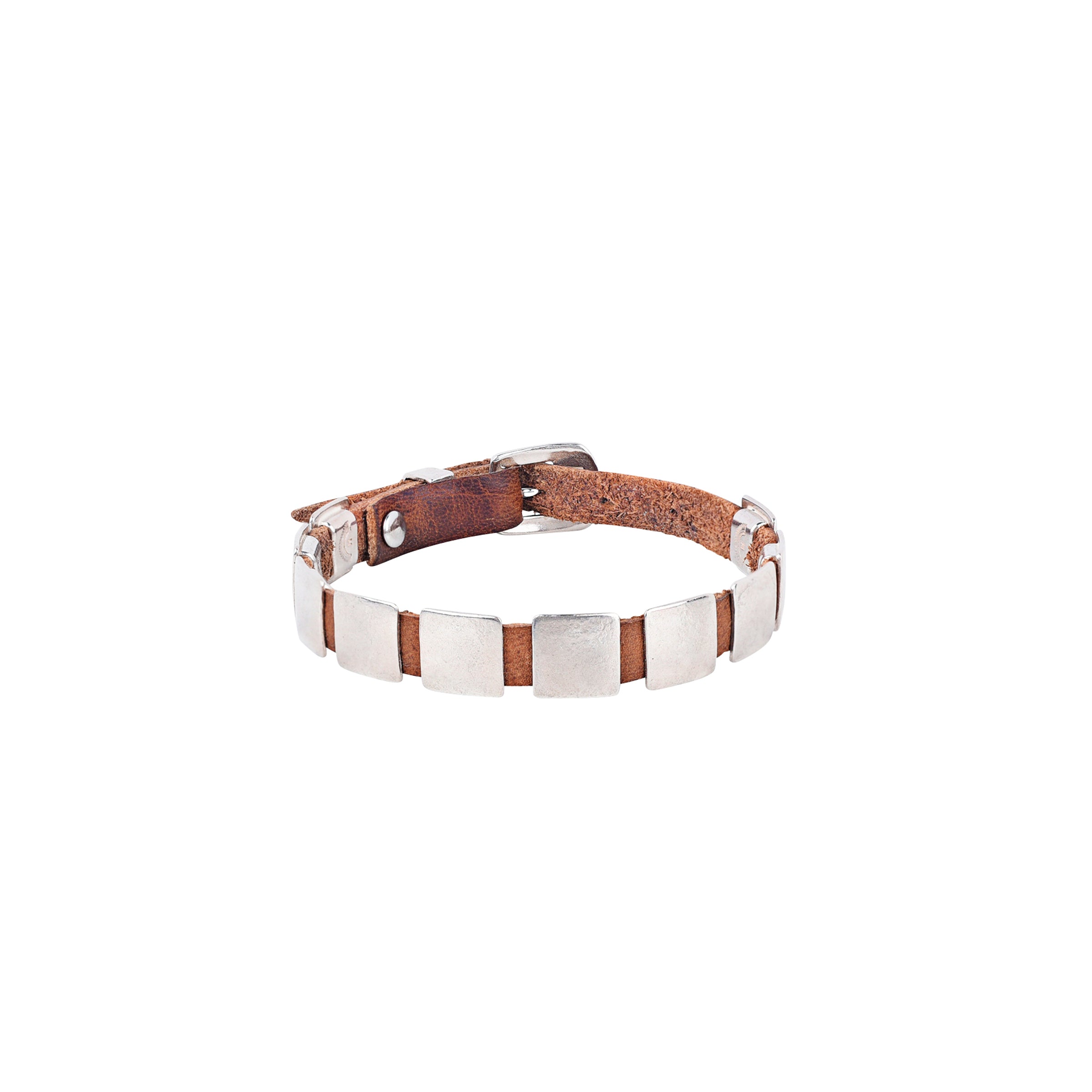 The Dennis Hogan Concho Bracelet features rich leather that wraps the wrist and sterling silver square conchos that echo traditional Southwestern design.