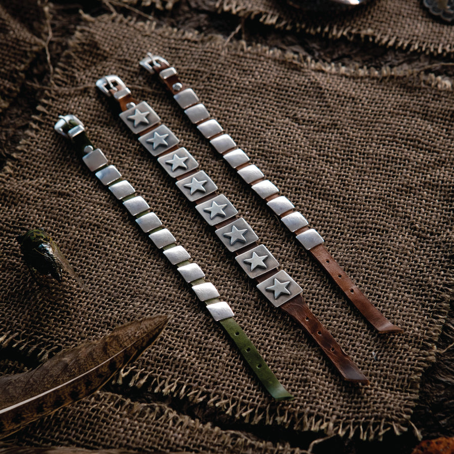 The Dennis Hogan Concho Bracelet features rich leather that wraps the wrist and sterling silver square conchos that echo traditional Southwestern design.