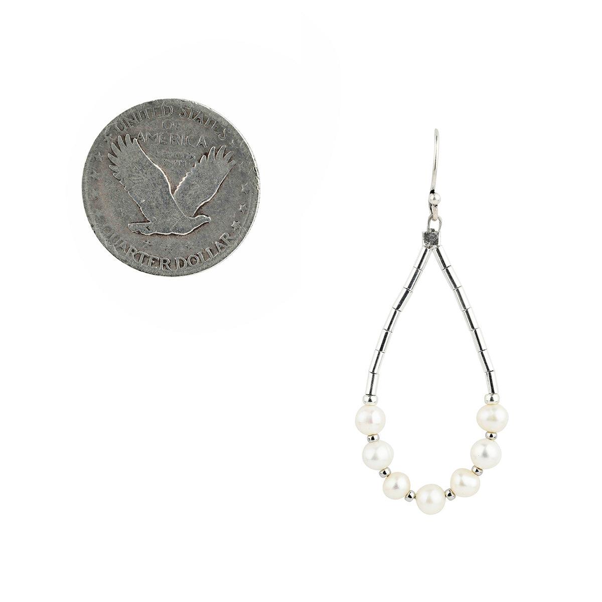 Pair of pearl drop earrings on a white background