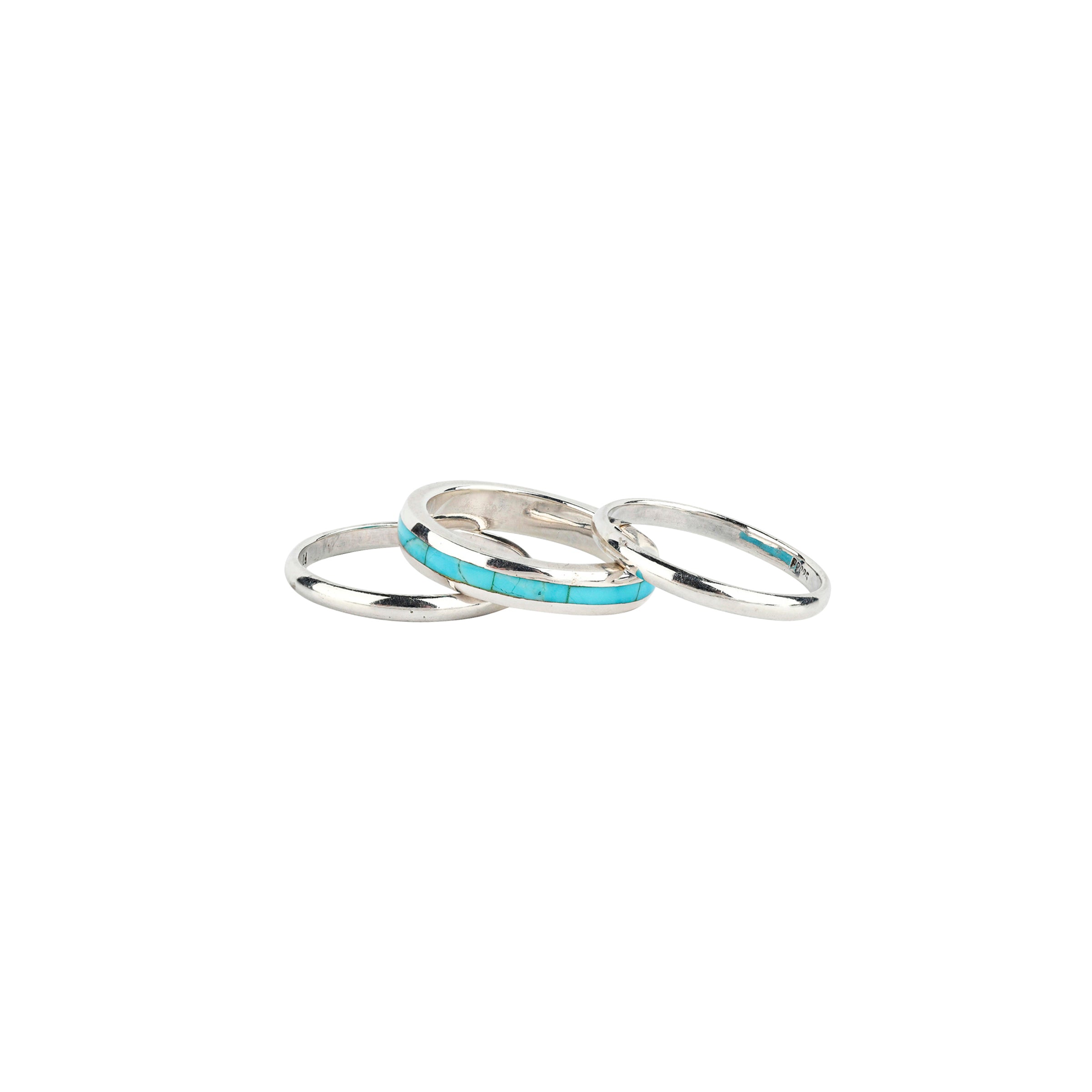 A set of three Sterling Silver rings with the middle band featuring Blue Turquoise. As seen in the Sundance Catalog.