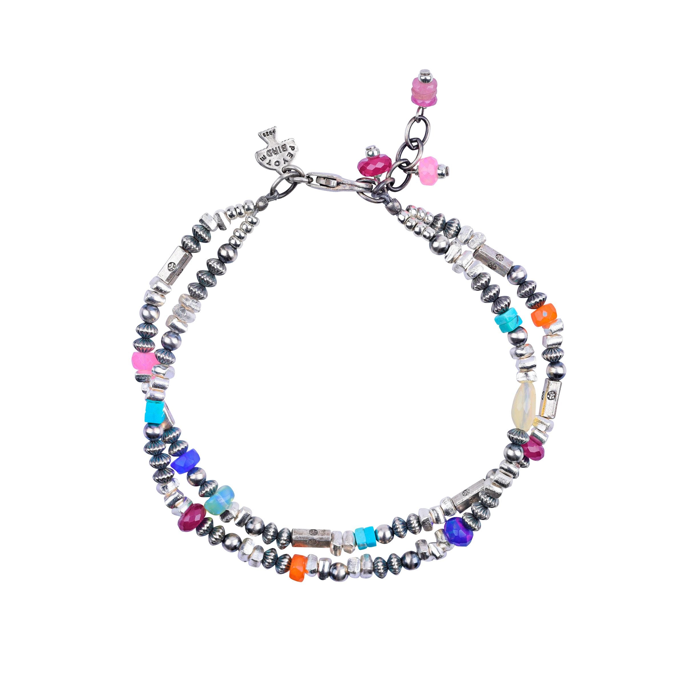 Peyote Bird original Lucky Charms bracelet. A beaded two-strand bracelet featuring sterling silver, blue turquoise, Ethiopian opals, and ruby.