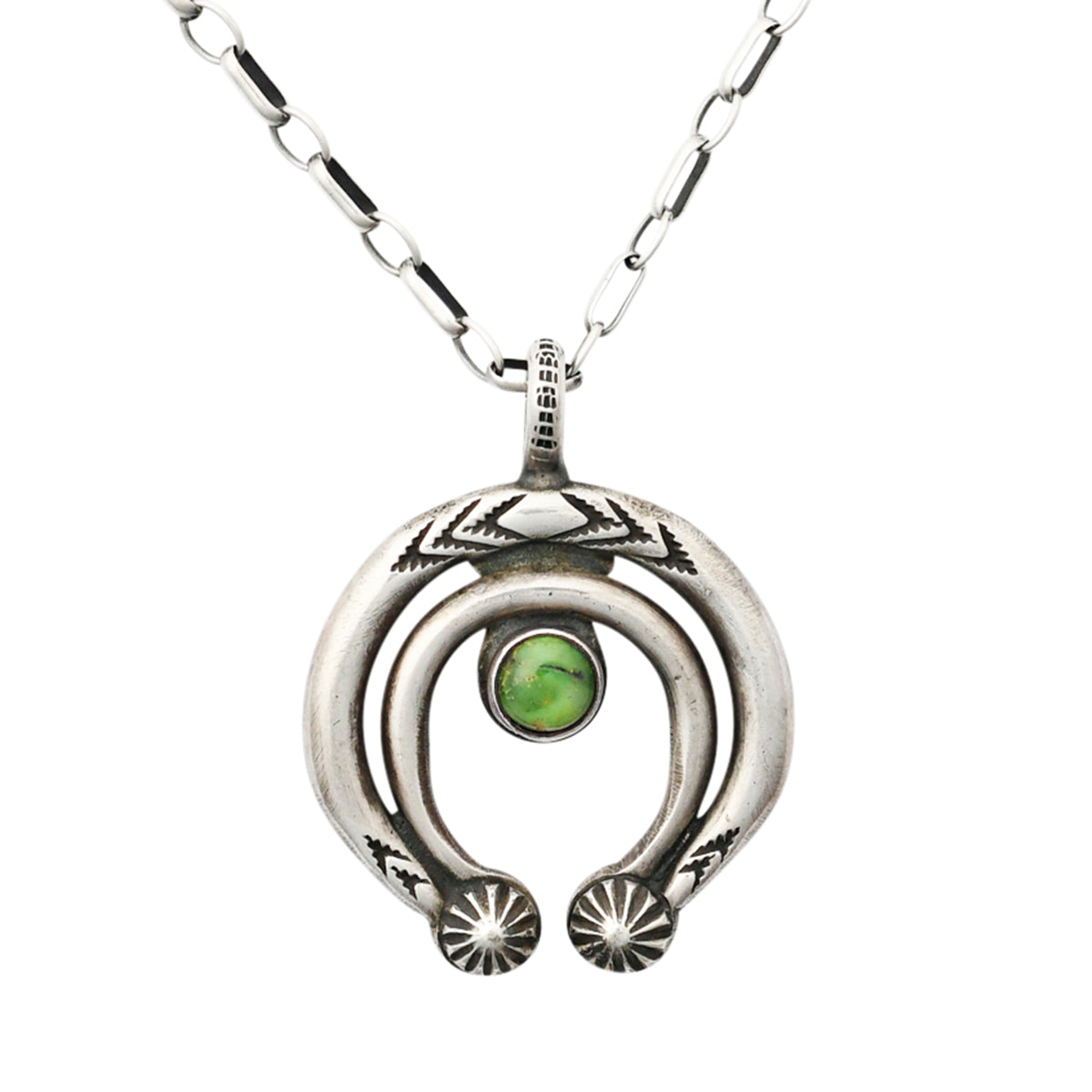 Classic Naja pendant featuring Southwestern motifs and a round of Green Turquoise strung on sterling silver chain.