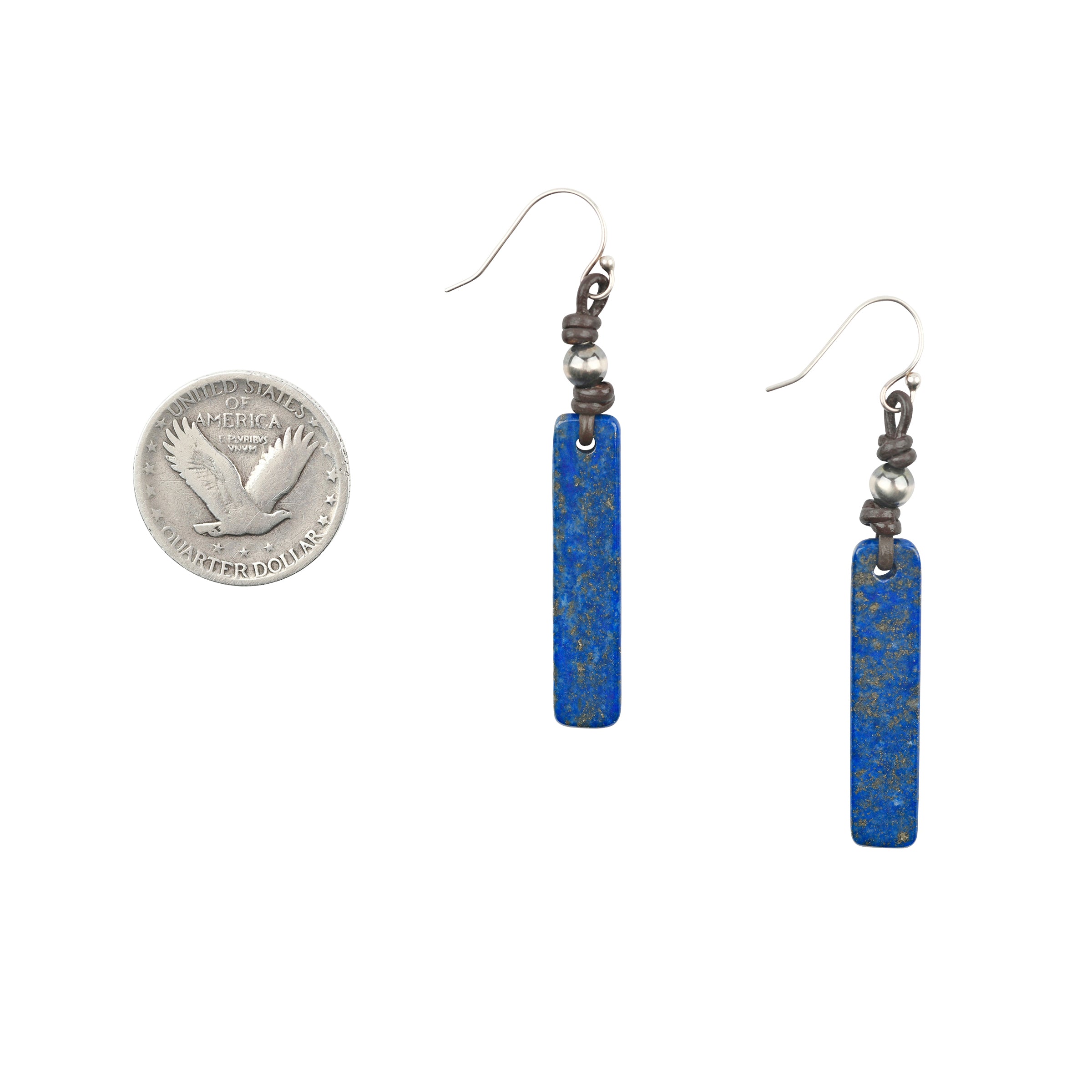 The Lapis Spires Earrings feature a long piece of Lapis Lazuli topped with a Desert Pearl on leather cord. Pair with your favorite Denim look! These earrings were a Sundance Catalog favorite for many years.