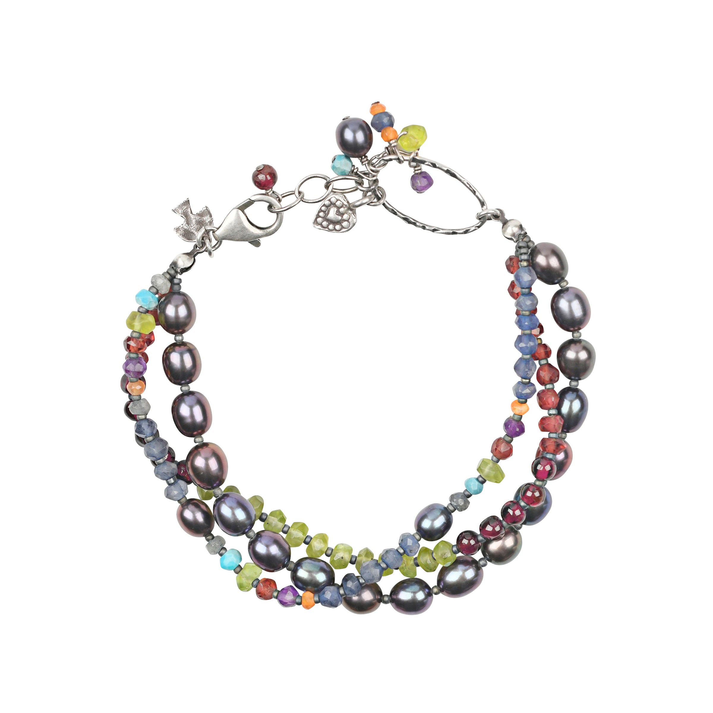 A multi-strand bracelet that once was featured in the Sundance Catalog. Strung with a medley of gemstones and freshwater Pearls