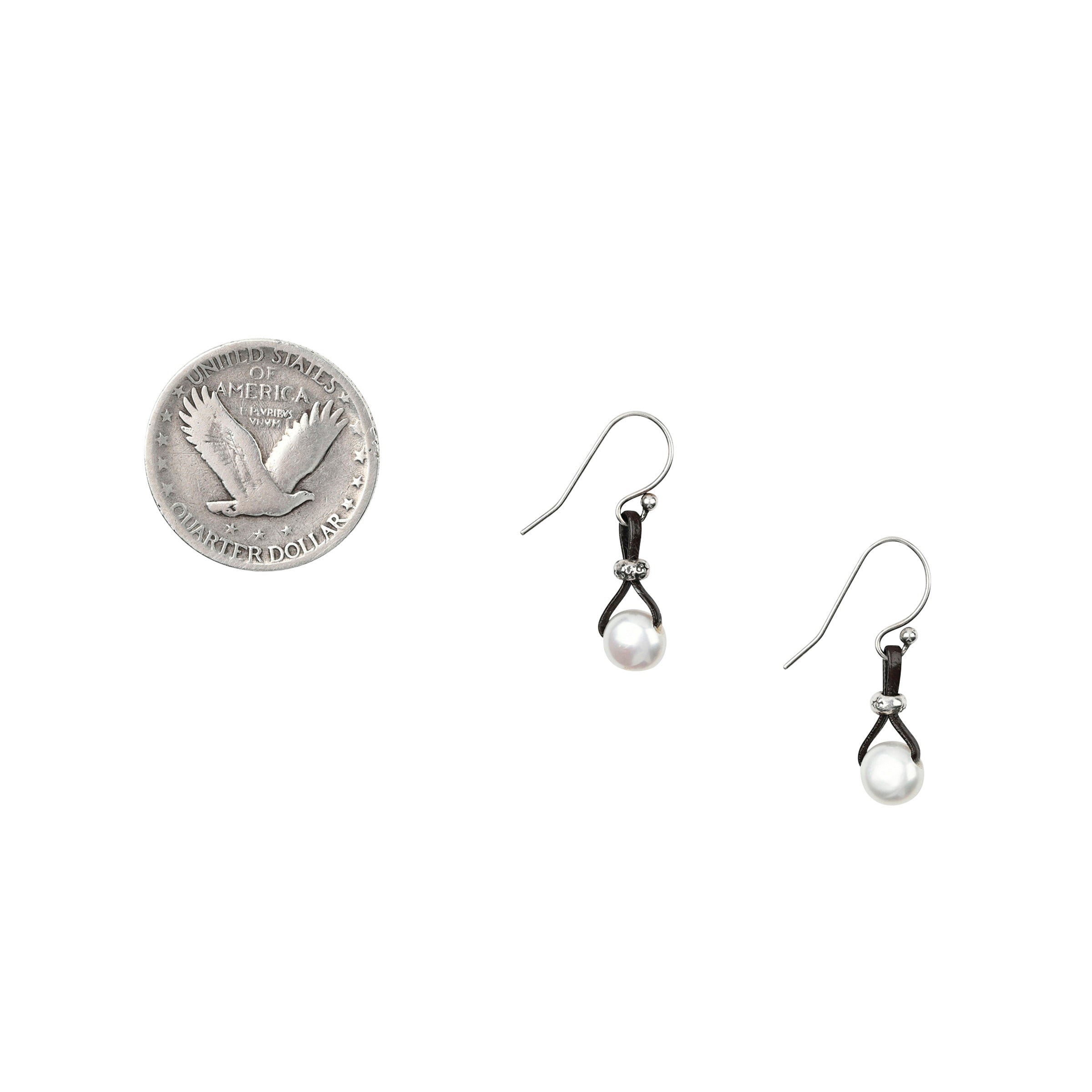 A pair of earrings made with Freshwater Pearl, Sterling Silver, and Leather in a teardrop shape.