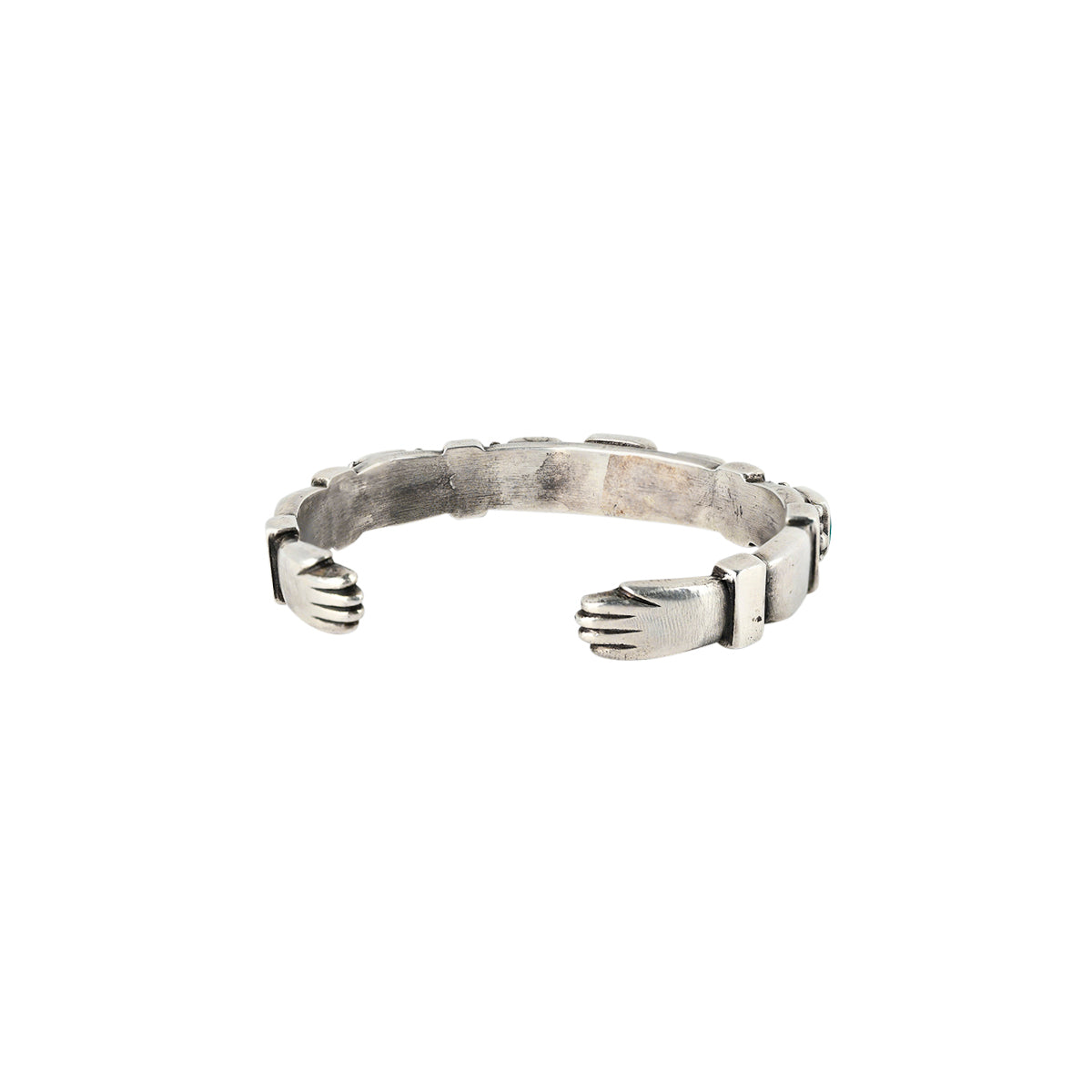 Ingot coin silver cuff with hand detailing on the terminals by Aldrich Art.